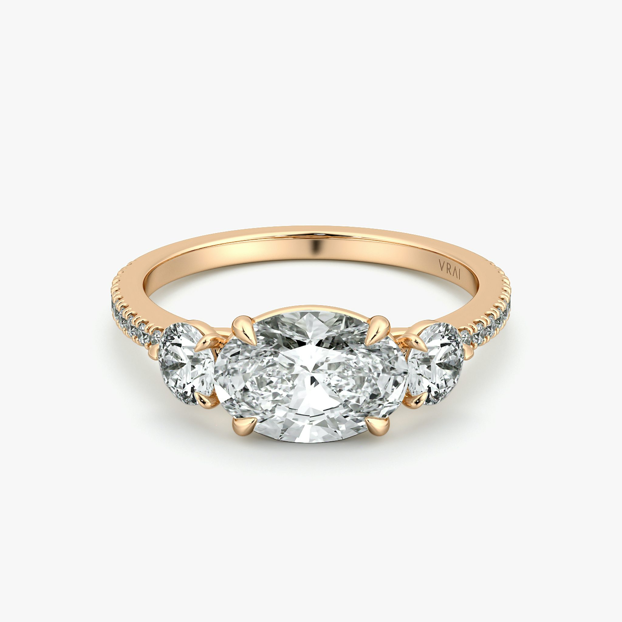 The Three Stone | Oval | 14k | Rose Gold | bandAccent: Pavé | diamondOrientation: horizontal | sideStoneCarat: 0.25ct | sideStoneShape: Round Brilliant | caratWeight: other