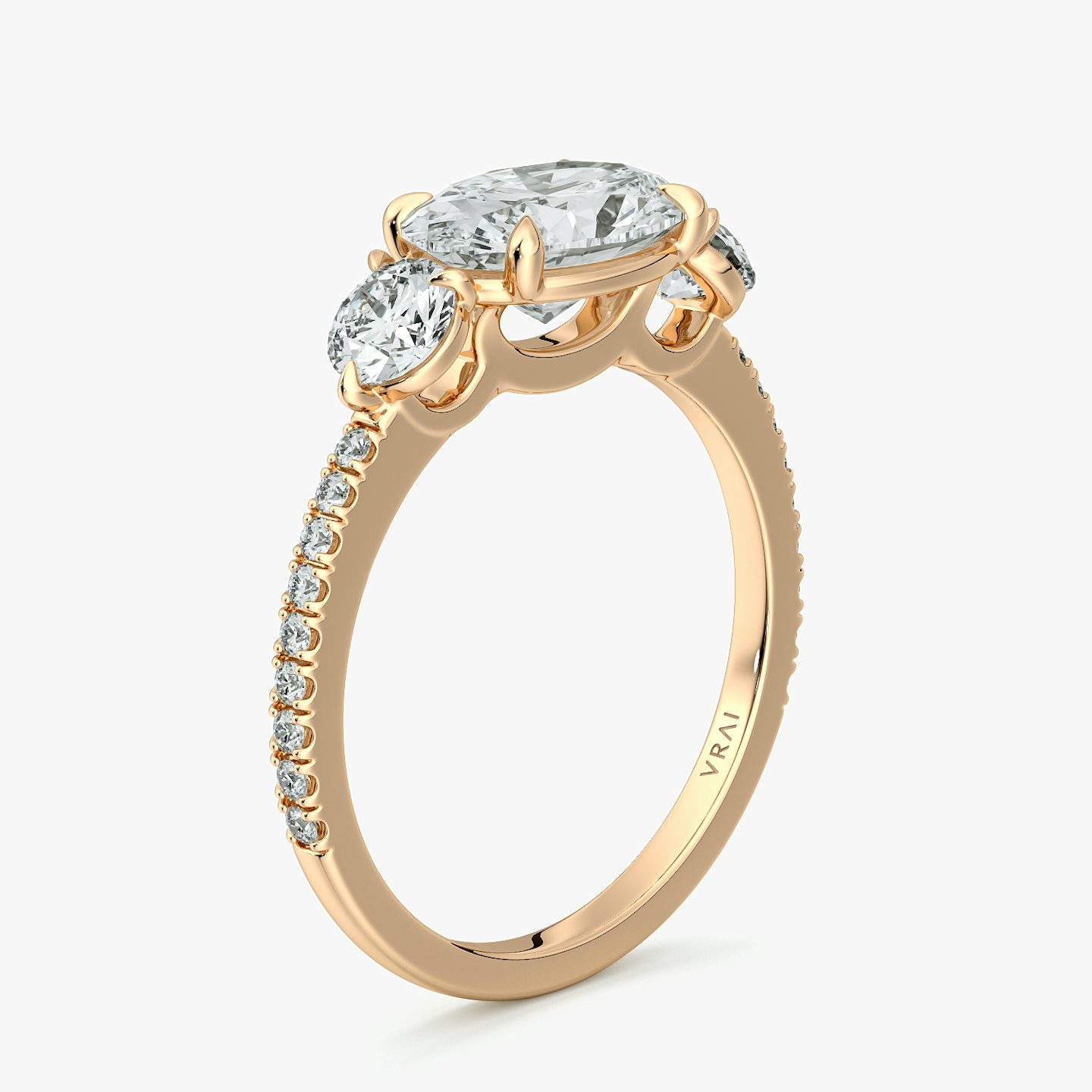 The Three Stone | Oval | 14k | Rose Gold | bandAccent: Pavé | diamondOrientation: horizontal | sideStoneCarat: 0.25ct | sideStoneShape: Round Brilliant | caratWeight: other