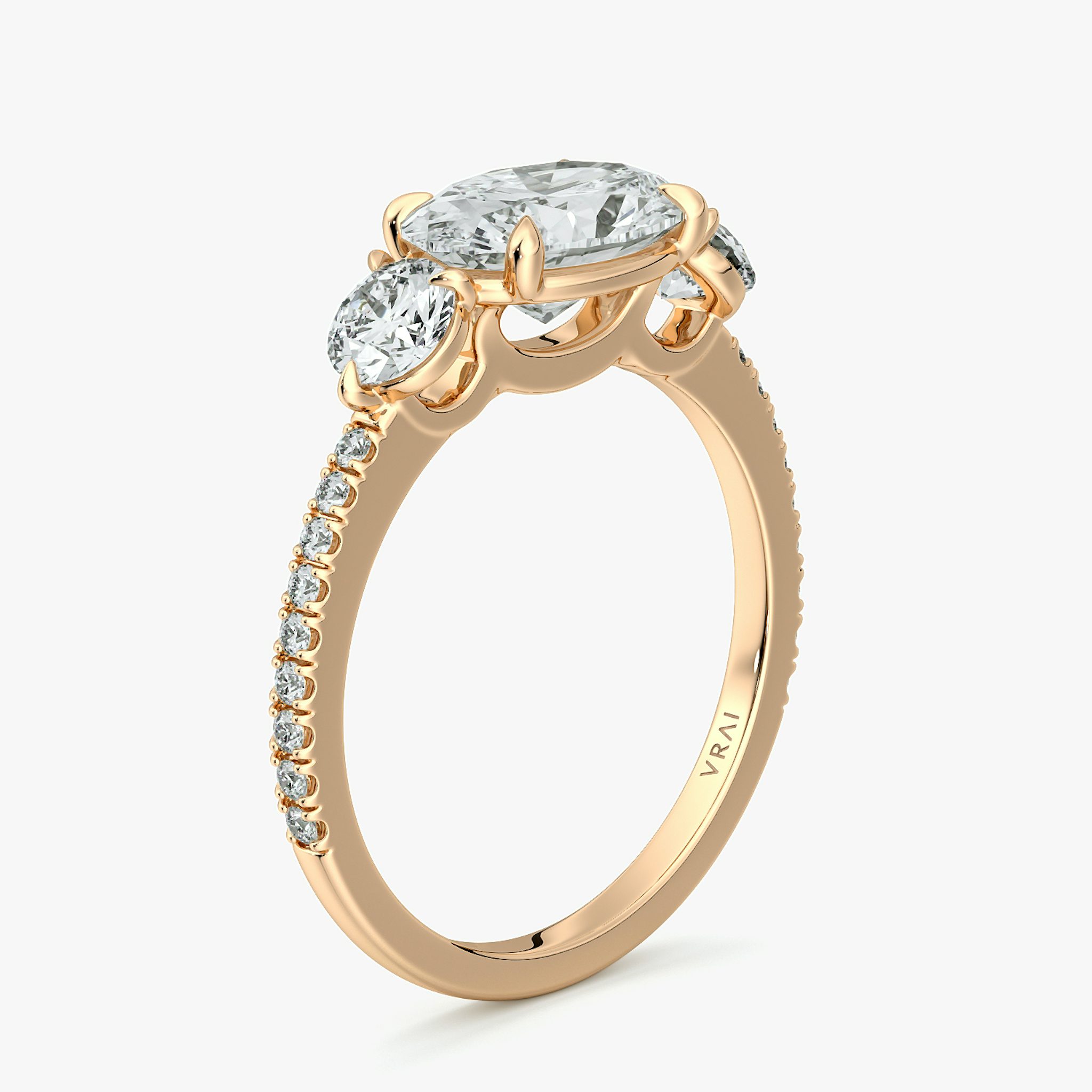 The Three Stone | Oval | 14k | Rose Gold | bandAccent: Pavé | diamondOrientation: horizontal | sideStoneCarat: 0.25ct | sideStoneShape: Round Brilliant | caratWeight: other