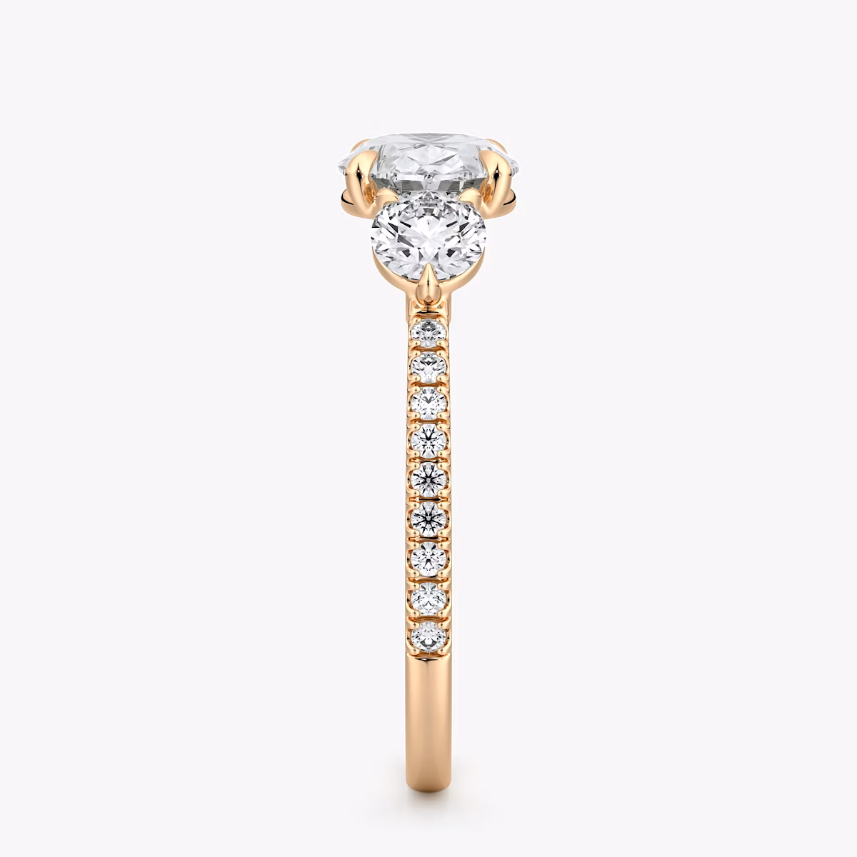 The Three Stone | Oval | 14k | Rose Gold | bandAccent: Pavé | diamondOrientation: horizontal | sideStoneCarat: 0.25ct | sideStoneShape: Round Brilliant | caratWeight: other