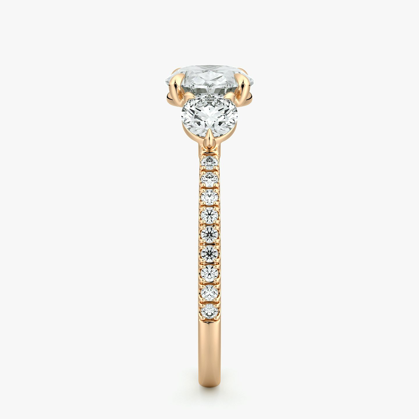 The Three Stone | Oval | 14k | Rose Gold | bandAccent: Pavé | diamondOrientation: horizontal | sideStoneCarat: 0.25ct | sideStoneShape: Round Brilliant | caratWeight: other