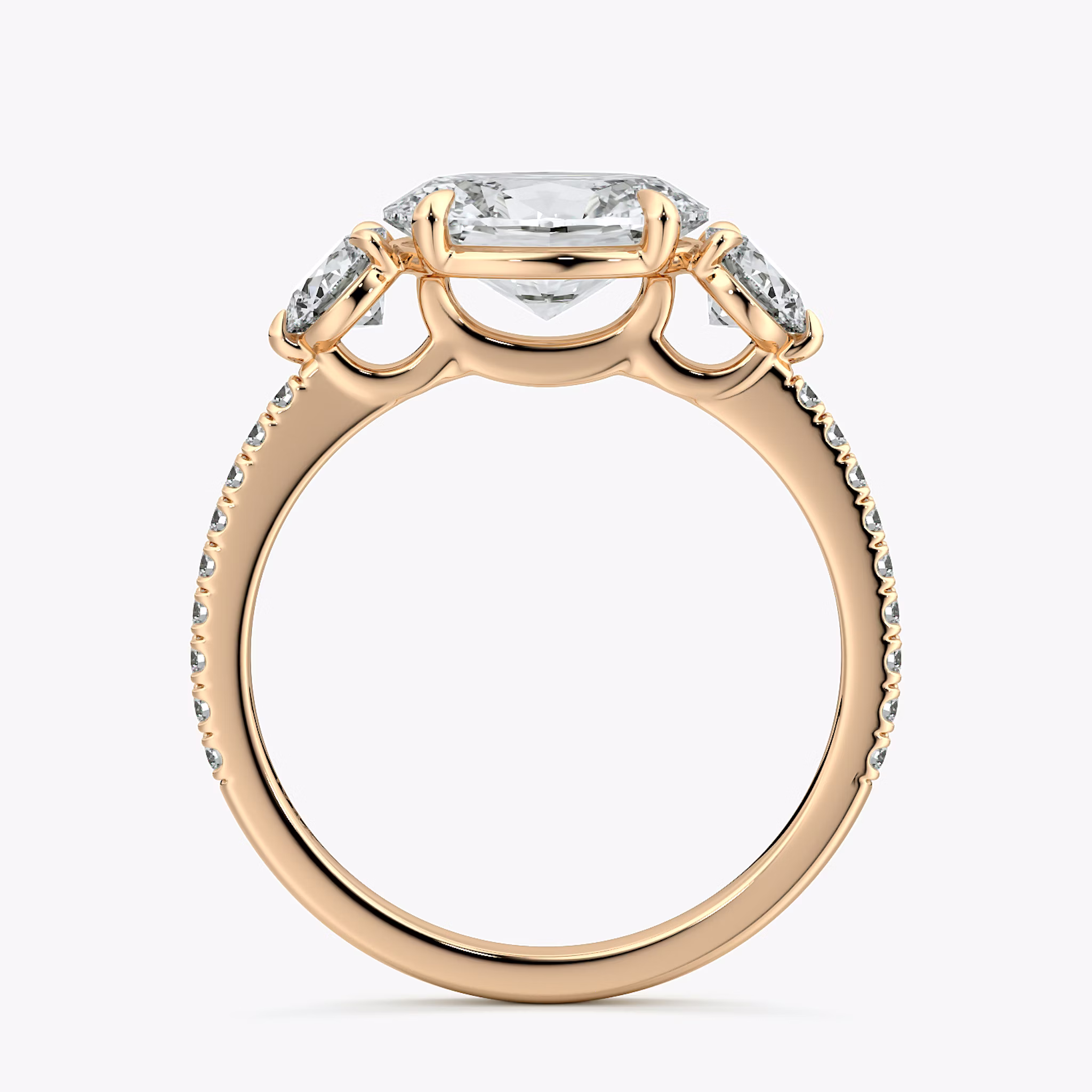 The Three Stone | Oval | 14k | Rose Gold | bandAccent: Pavé | diamondOrientation: horizontal | sideStoneCarat: 0.25ct | sideStoneShape: Round Brilliant | caratWeight: other