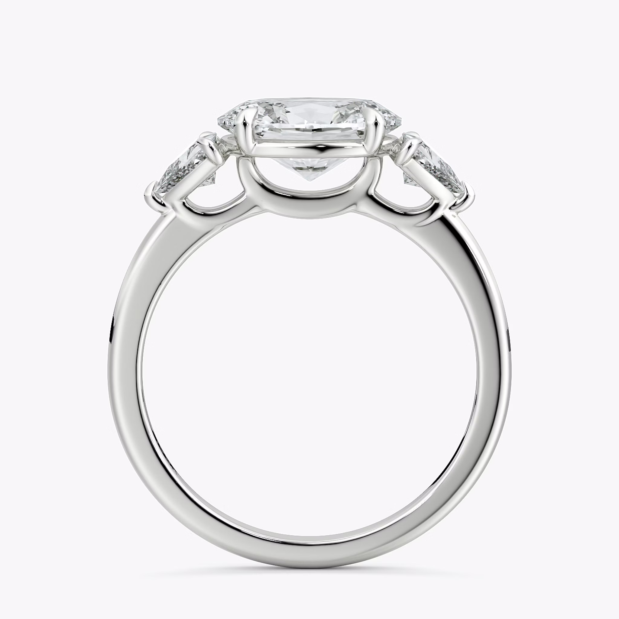 The Three Stone | Oval | 18k | White Gold | bandAccent: Plain | diamondOrientation: horizontal | sideStoneCarat: 0.25ct | sideStoneShape: Trillion | caratWeight: other