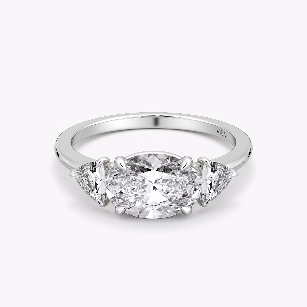 The Three Stone | Oval | Platinum | bandAccent: Plain | diamondOrientation: horizontal | sideStoneCarat: 0.25ct | sideStoneShape: Trillion | caratWeight: other