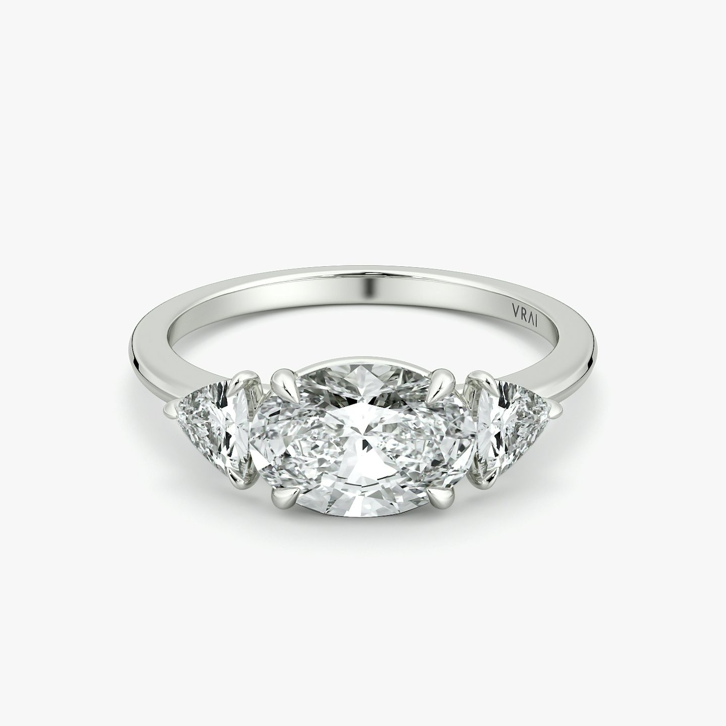 The Three Stone | Oval | 18k | White Gold | bandAccent: Plain | diamondOrientation: horizontal | sideStoneCarat: 0.25ct | sideStoneShape: Trillion | caratWeight: other