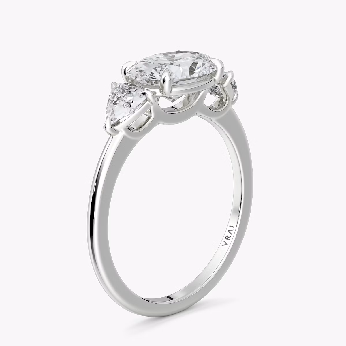 The Three Stone | Oval | Platinum | bandAccent: Plain | diamondOrientation: horizontal | sideStoneCarat: 0.25ct | sideStoneShape: Trillion | caratWeight: other