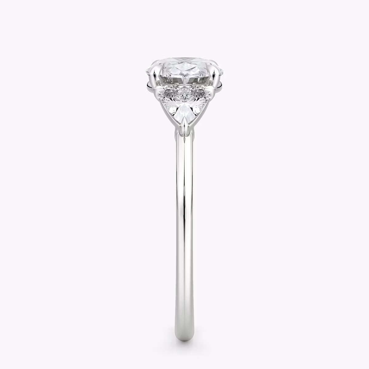 The Three Stone | Oval | Platinum | bandAccent: Plain | diamondOrientation: horizontal | sideStoneCarat: 0.25ct | sideStoneShape: Trillion | caratWeight: other