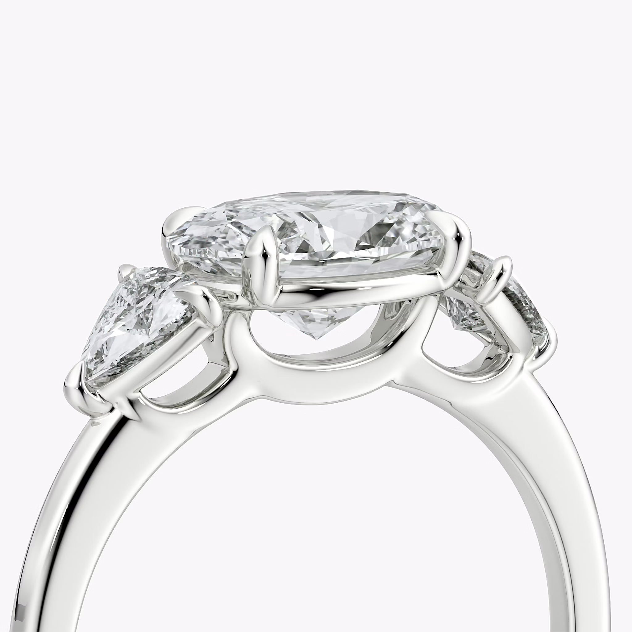 The Three Stone | Oval | 18k | White Gold | bandAccent: Plain | diamondOrientation: horizontal | sideStoneCarat: 0.25ct | sideStoneShape: Trillion | caratWeight: other