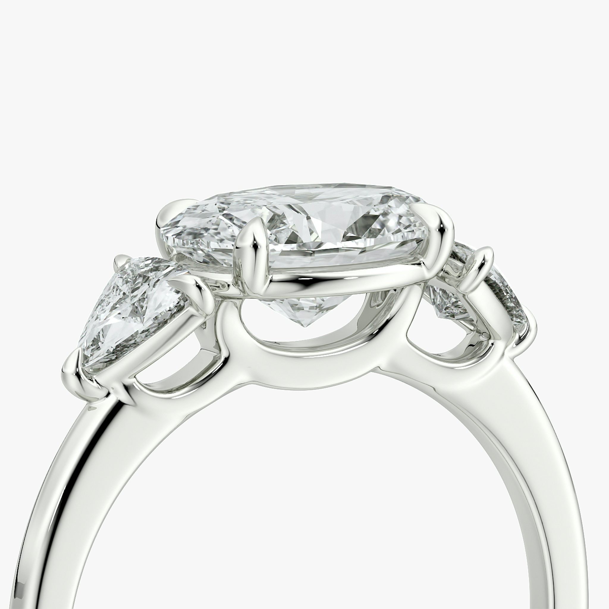 The Three Stone | Oval | 18k | White Gold | bandAccent: Plain | diamondOrientation: horizontal | sideStoneCarat: 0.25ct | sideStoneShape: Trillion | caratWeight: other