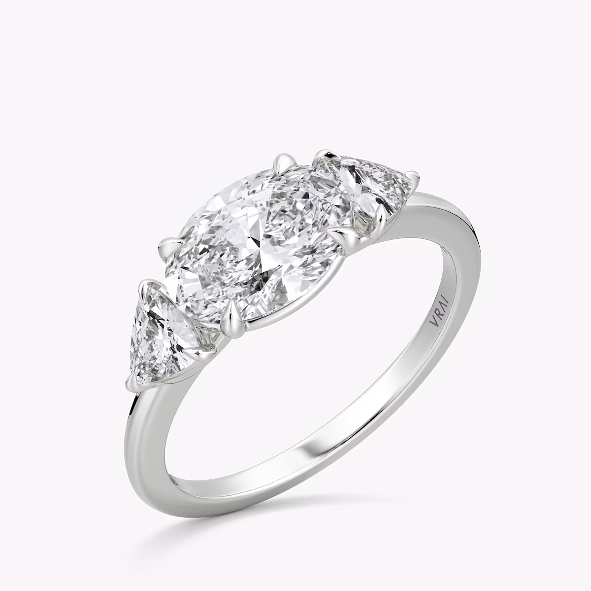 The Three Stone | Oval | Platinum | bandAccent: Plain | diamondOrientation: horizontal | sideStoneCarat: 0.25ct | sideStoneShape: Trillion | caratWeight: other