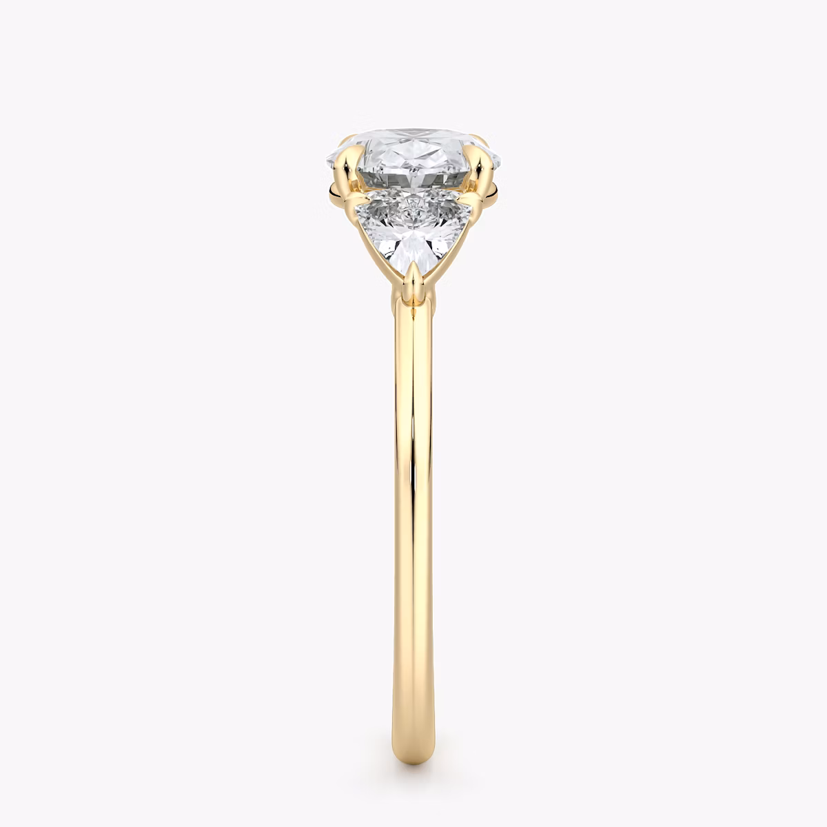 The Three Stone | Oval | 18k | Yellow Gold | bandAccent: Plain | diamondOrientation: horizontal | sideStoneCarat: 0.25ct | sideStoneShape: Trillion | caratWeight: other