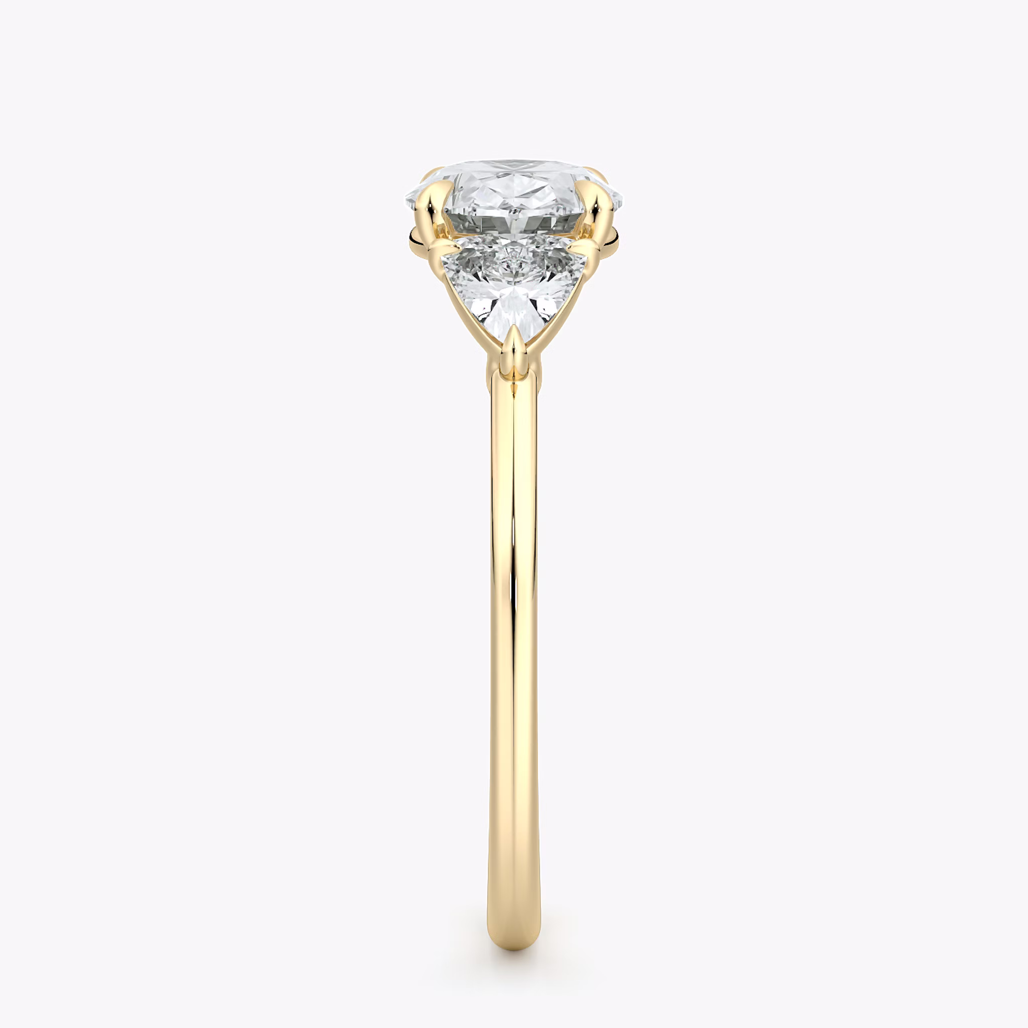 The Three Stone | Oval | 18k | Yellow Gold | bandAccent: Plain | diamondOrientation: horizontal | sideStoneCarat: 0.25ct | sideStoneShape: Trillion | caratWeight: other