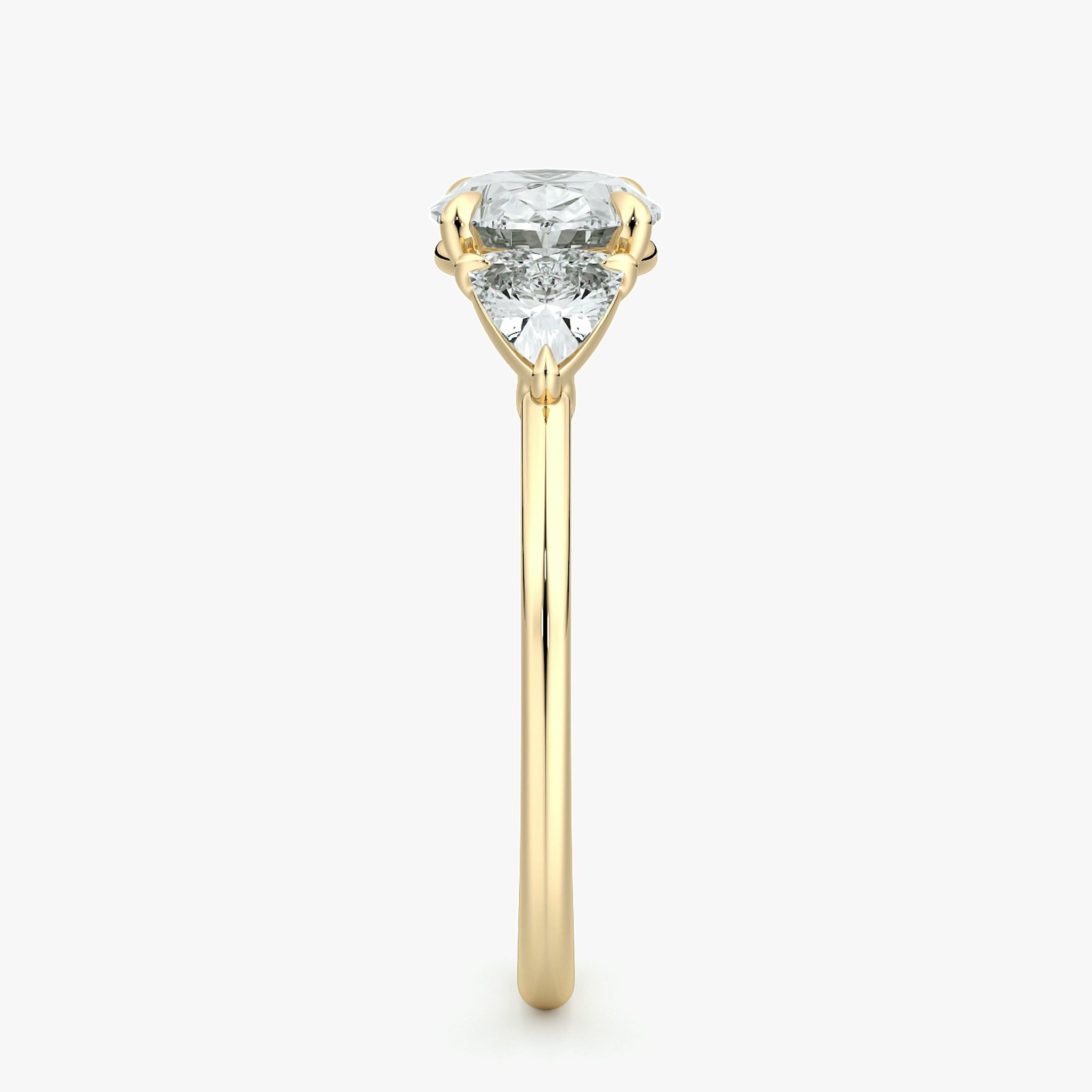 The Three Stone | Oval | 18k | Yellow Gold | bandAccent: Plain | diamondOrientation: horizontal | sideStoneCarat: 0.25ct | sideStoneShape: Trillion | caratWeight: other