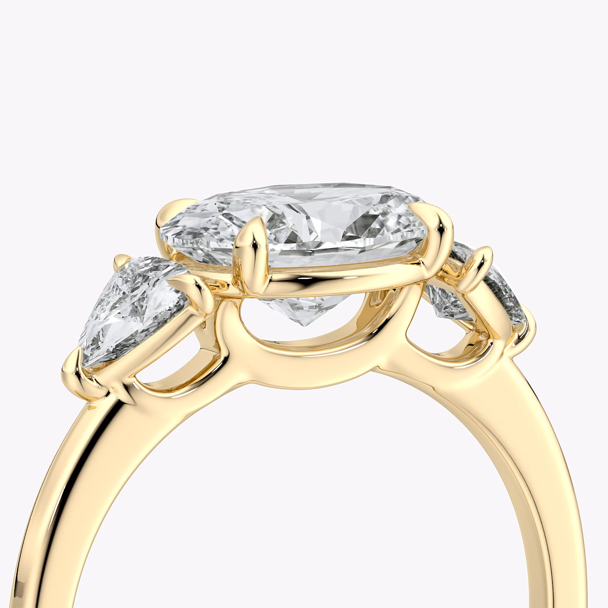The Three Stone | Oval | 18k | Yellow Gold | bandAccent: Plain | diamondOrientation: horizontal | sideStoneCarat: 0.25ct | sideStoneShape: Trillion | caratWeight: other