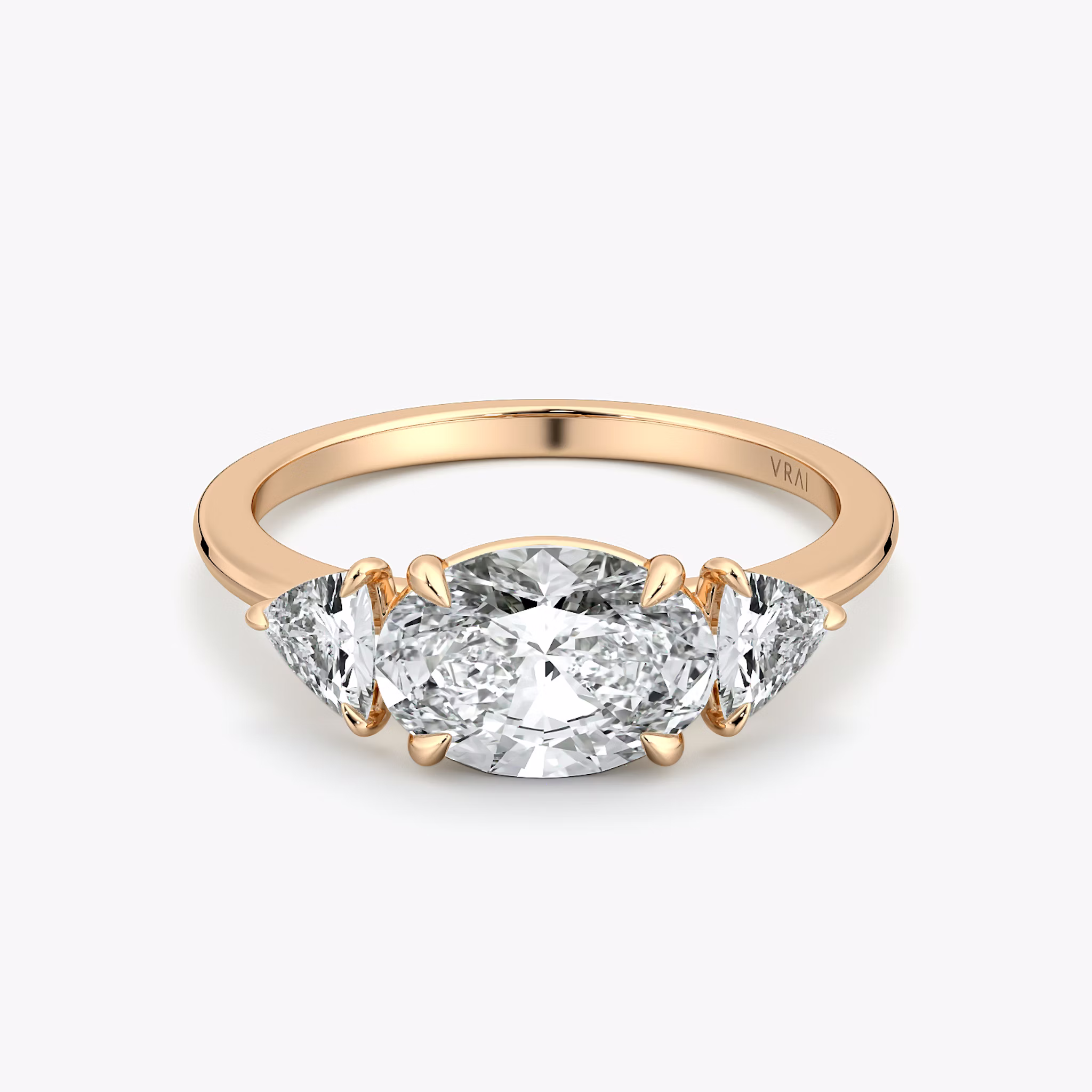 The Three Stone | Oval | 14k | Rose Gold | bandAccent: Plain | diamondOrientation: horizontal | sideStoneCarat: 0.25ct | sideStoneShape: Trillion | caratWeight: other