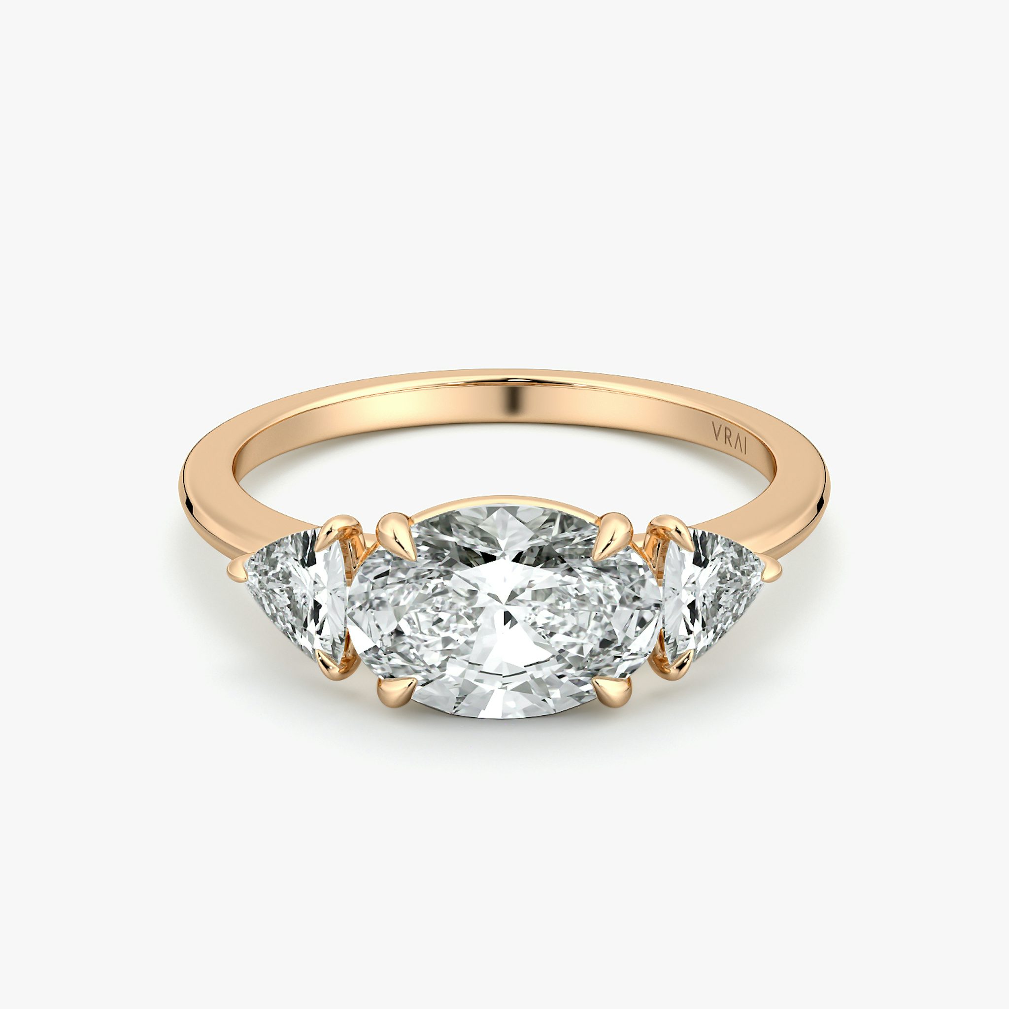 The Three Stone | Oval | 14k | Rose Gold | bandAccent: Plain | diamondOrientation: horizontal | sideStoneCarat: 0.25ct | sideStoneShape: Trillion | caratWeight: other