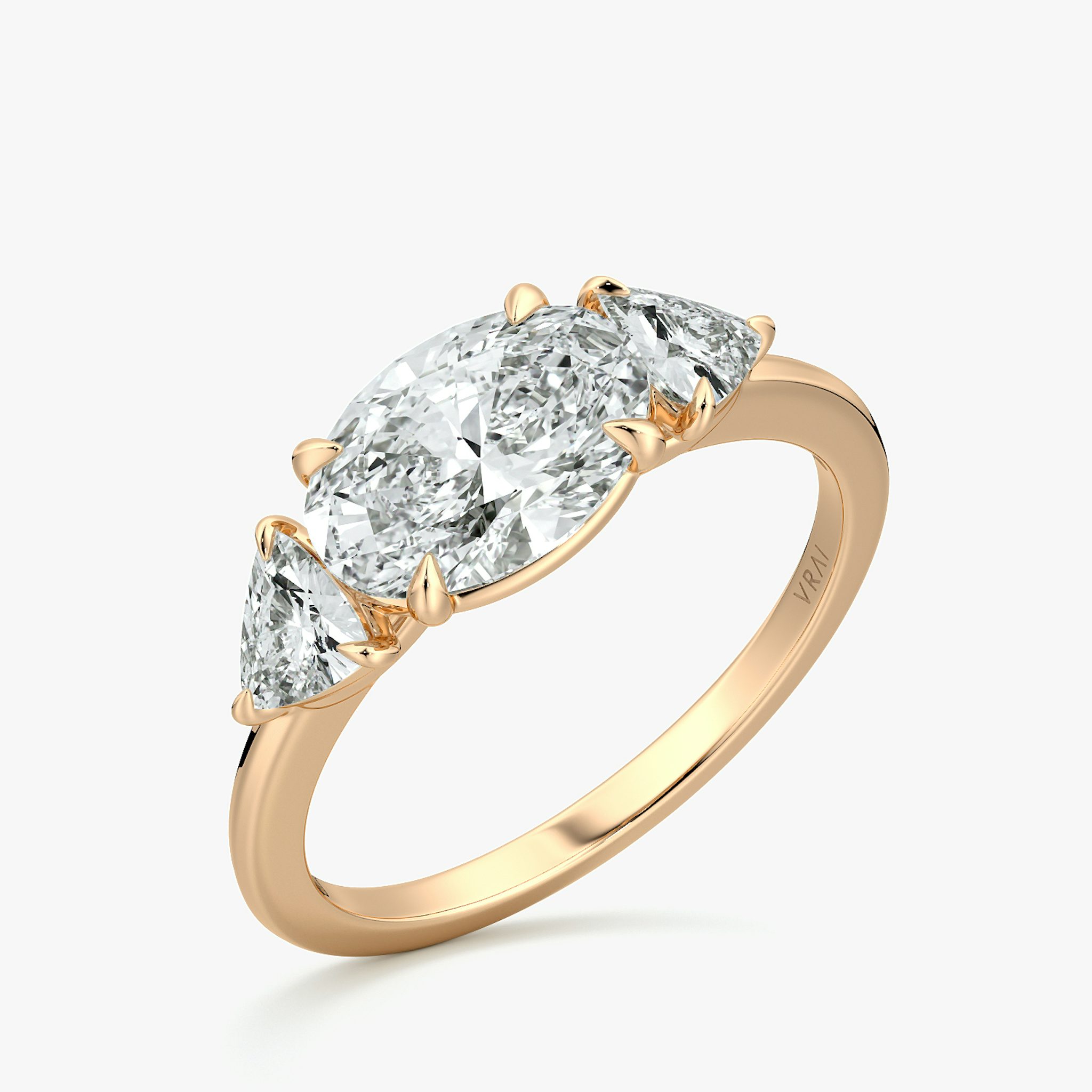 The Three Stone | Oval | 14k | Rose Gold | bandAccent: Plain | diamondOrientation: horizontal | sideStoneCarat: 0.25ct | sideStoneShape: Trillion | caratWeight: other