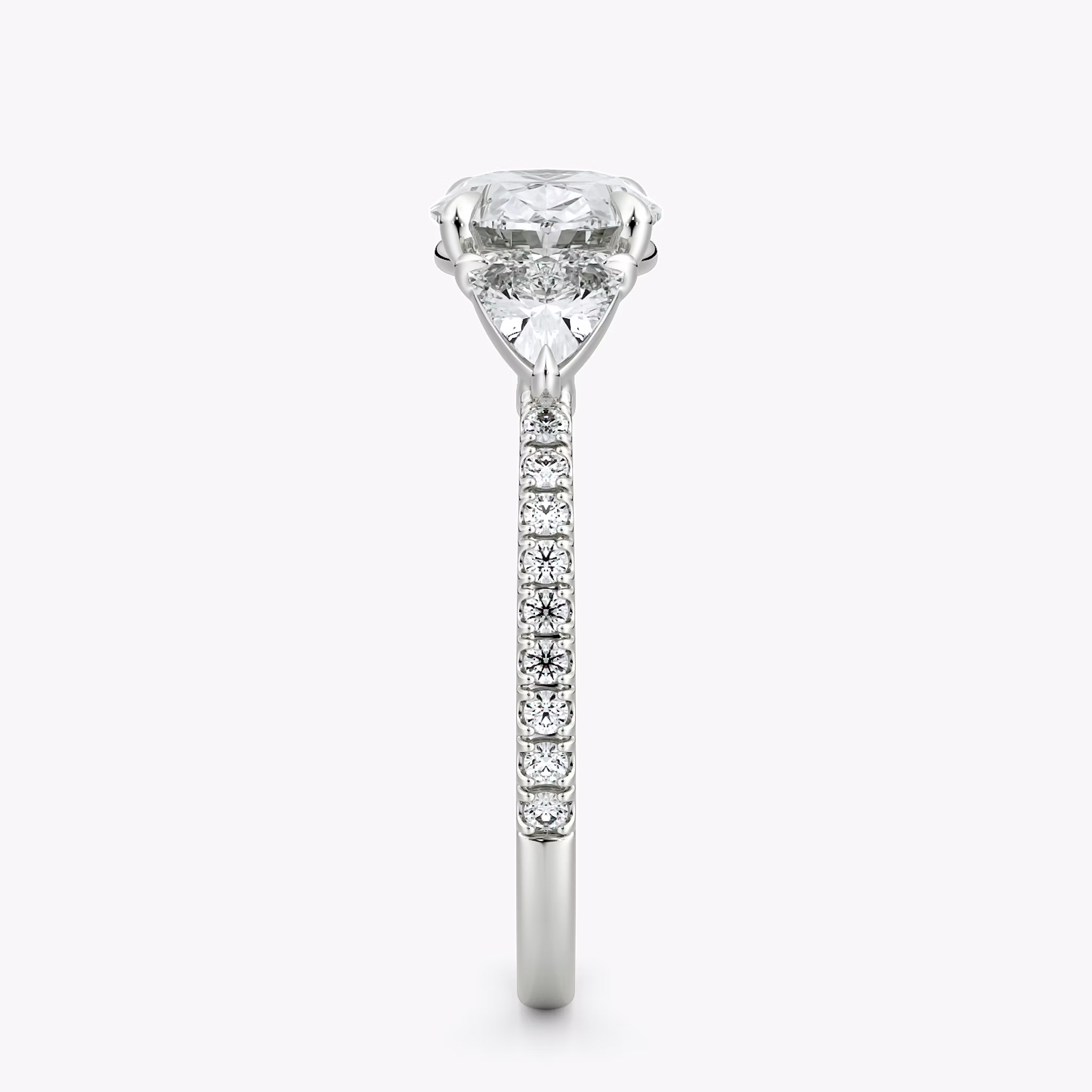 The Three Stone | Oval | Platinum | bandAccent: Pavé | diamondOrientation: horizontal | sideStoneCarat: 0.25ct | sideStoneShape: Trillion | caratWeight: other
