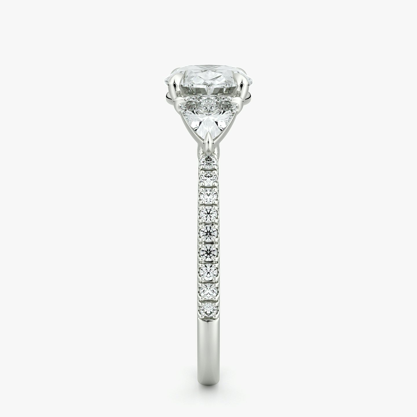 The Three Stone | Oval | 18k | White Gold | bandAccent: Pavé | diamondOrientation: horizontal | sideStoneCarat: 0.25ct | sideStoneShape: Trillion | caratWeight: other