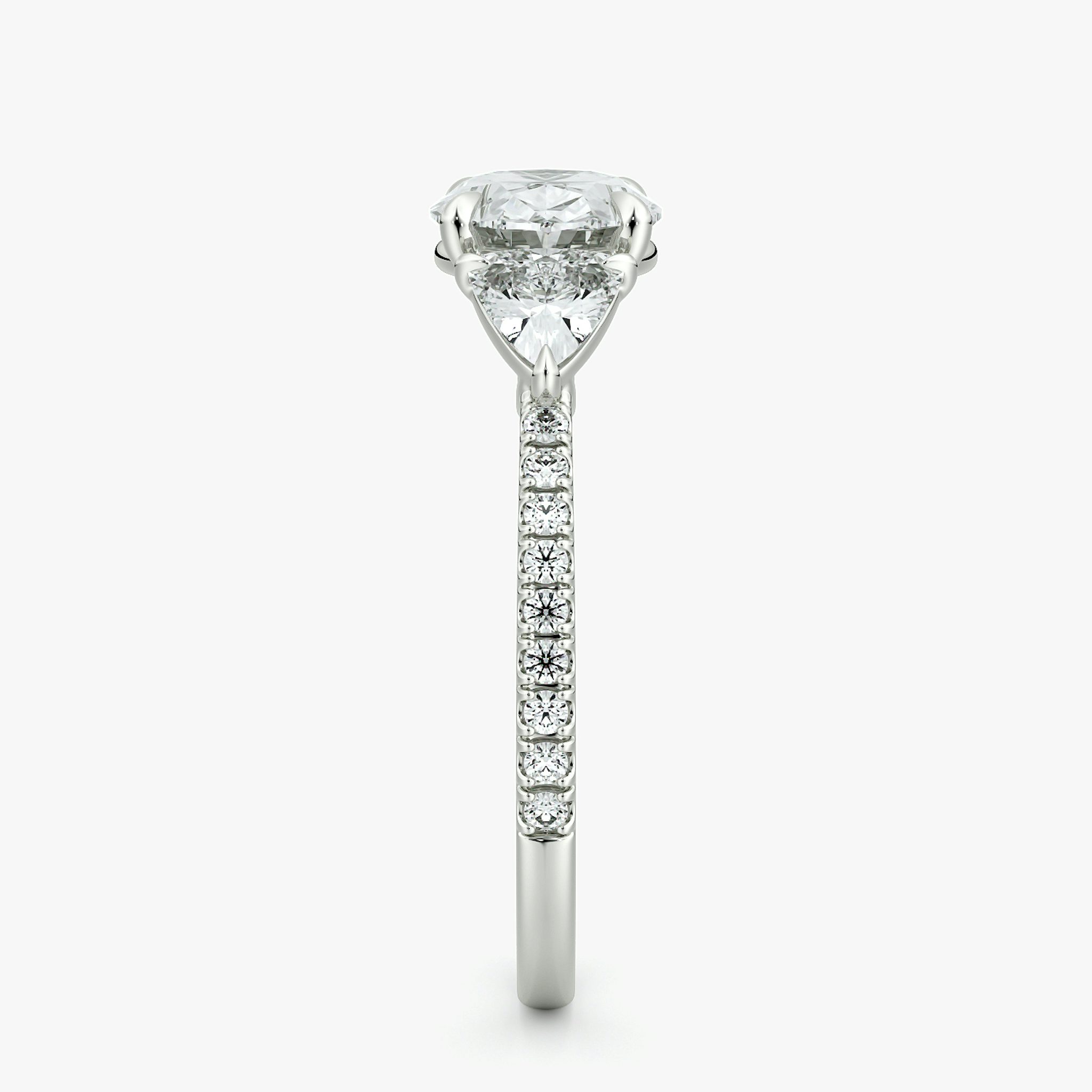 The Three Stone | Oval | Platinum | bandAccent: Pavé | diamondOrientation: horizontal | sideStoneCarat: 0.25ct | sideStoneShape: Trillion | caratWeight: other