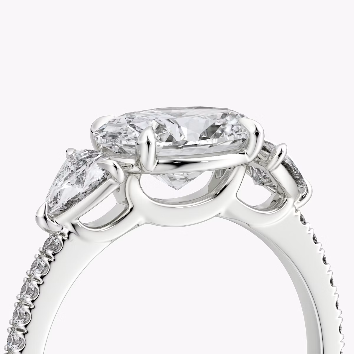 The Three Stone | Oval | 18k | White Gold | bandAccent: Pavé | diamondOrientation: horizontal | sideStoneCarat: 0.25ct | sideStoneShape: Trillion | caratWeight: other