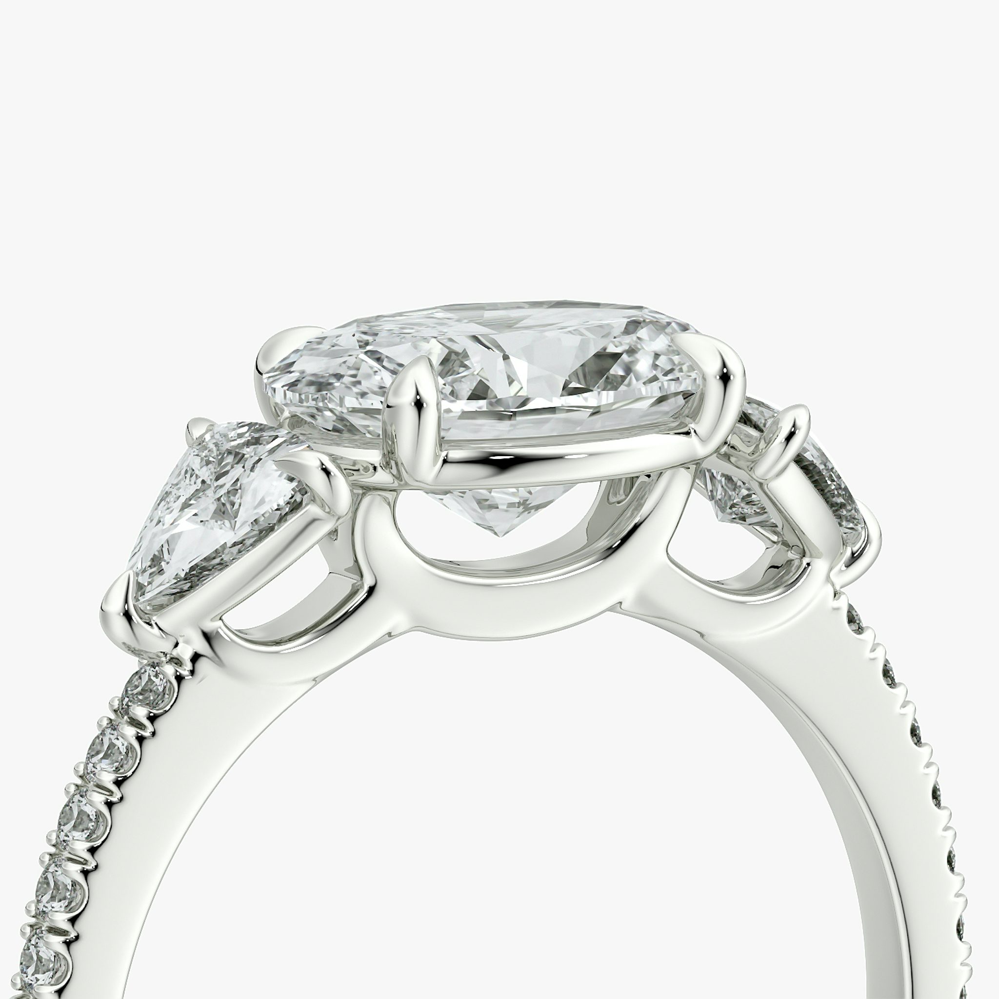 The Three Stone | Oval | Platinum | bandAccent: Pavé | diamondOrientation: horizontal | sideStoneCarat: 0.25ct | sideStoneShape: Trillion | caratWeight: other