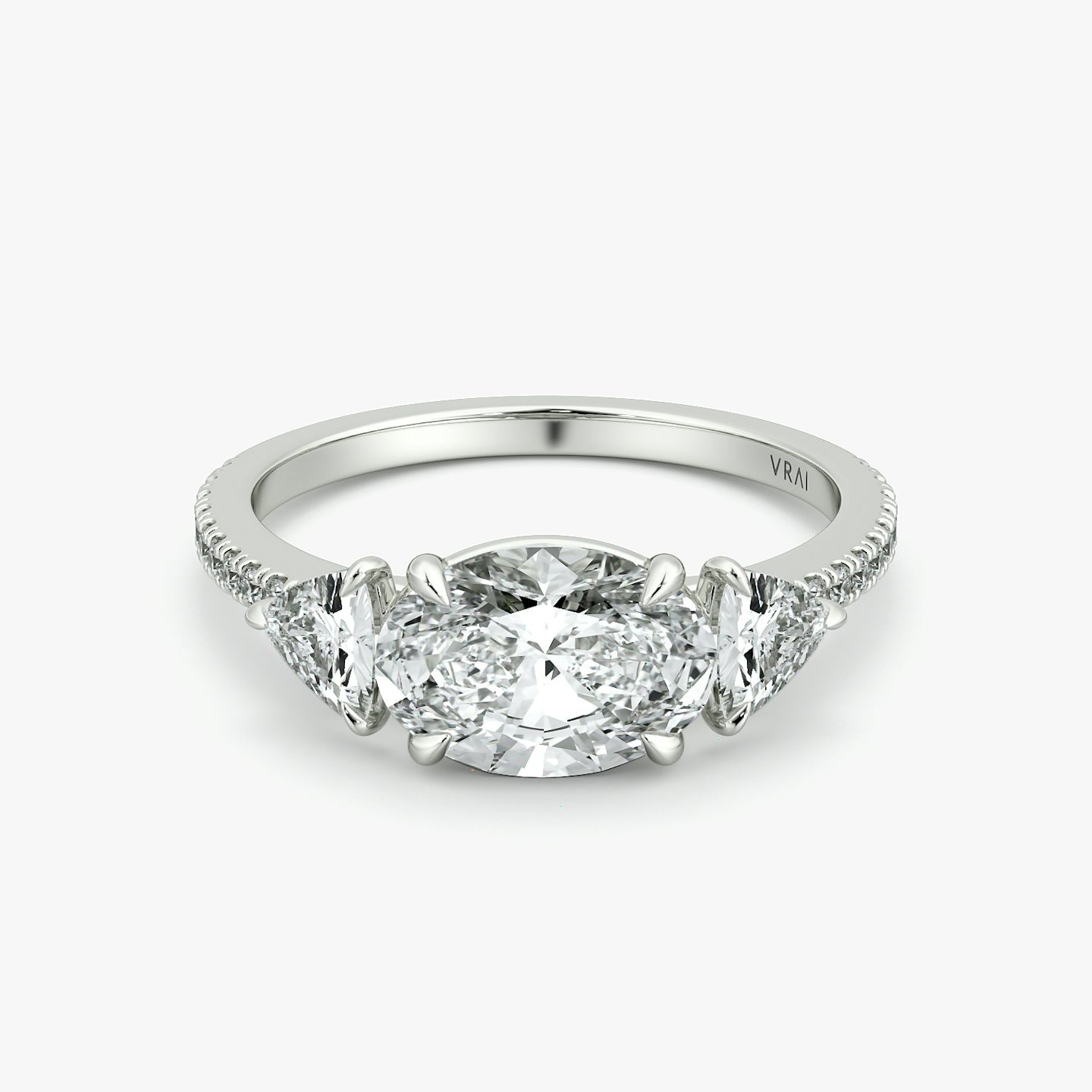 The Three Stone | Oval | 18k | White Gold | bandAccent: Pavé | diamondOrientation: horizontal | sideStoneCarat: 0.25ct | sideStoneShape: Trillion | caratWeight: other