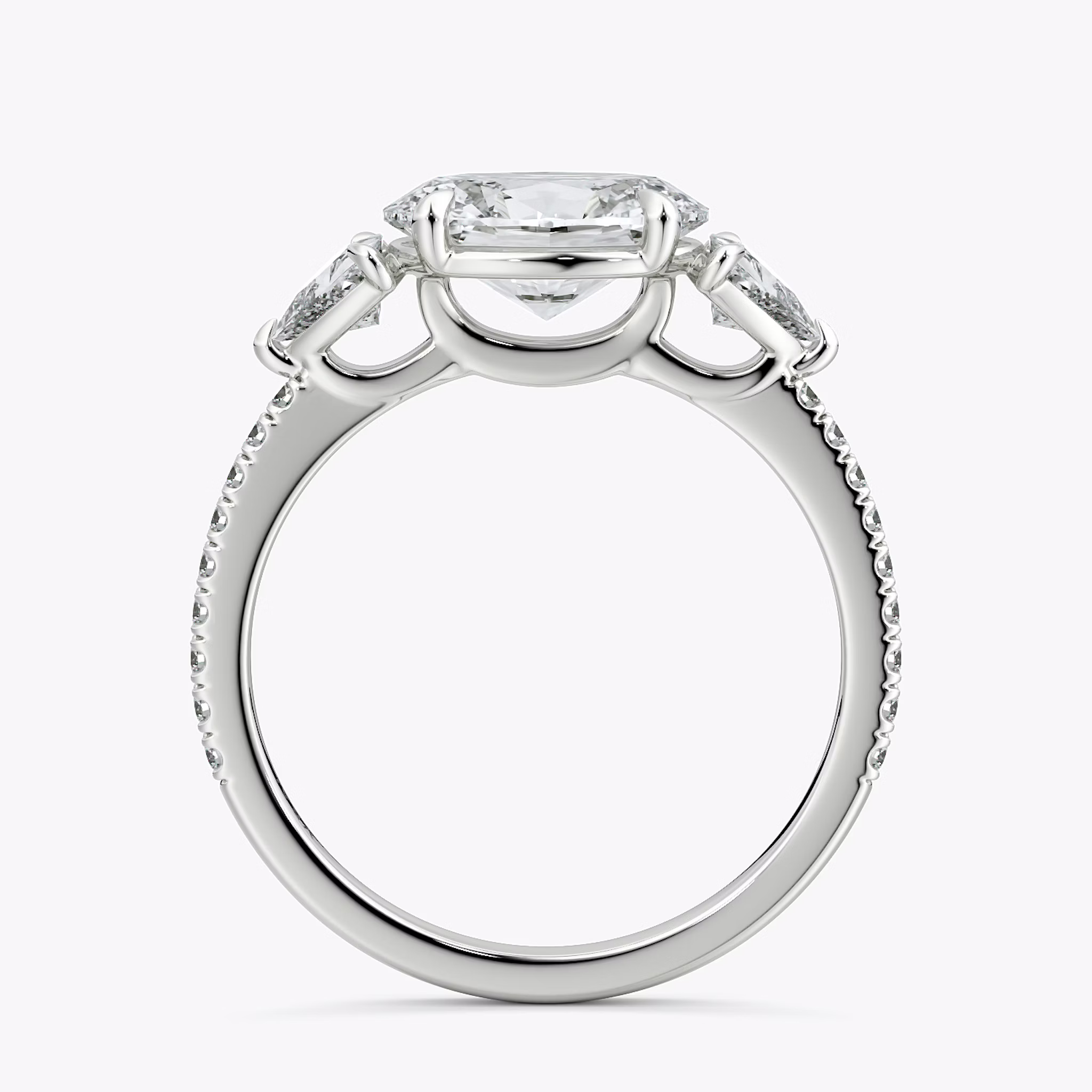The Three Stone | Oval | Platinum | bandAccent: Pavé | diamondOrientation: horizontal | sideStoneCarat: 0.25ct | sideStoneShape: Trillion | caratWeight: other