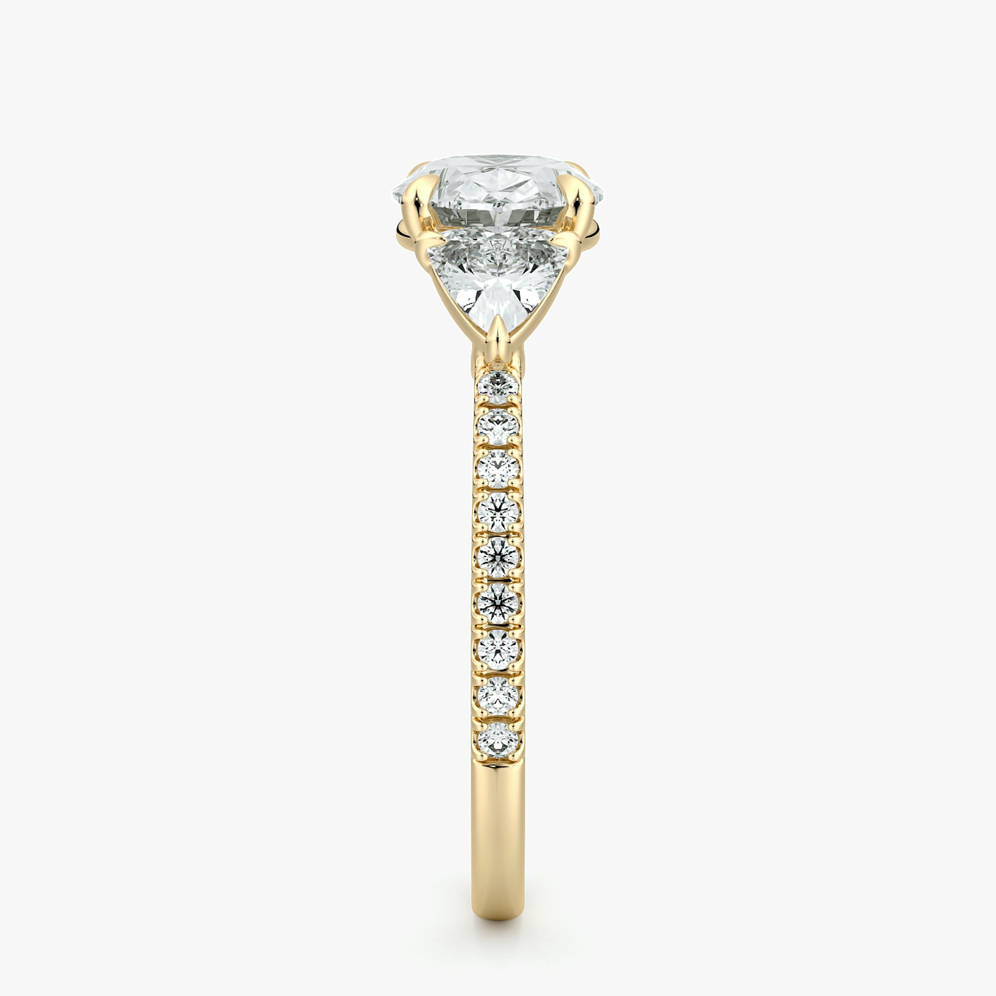 The Three Stone | Oval | 18k | Yellow Gold | bandAccent: Pavé | diamondOrientation: horizontal | sideStoneCarat: 0.25ct | sideStoneShape: Trillion | caratWeight: other