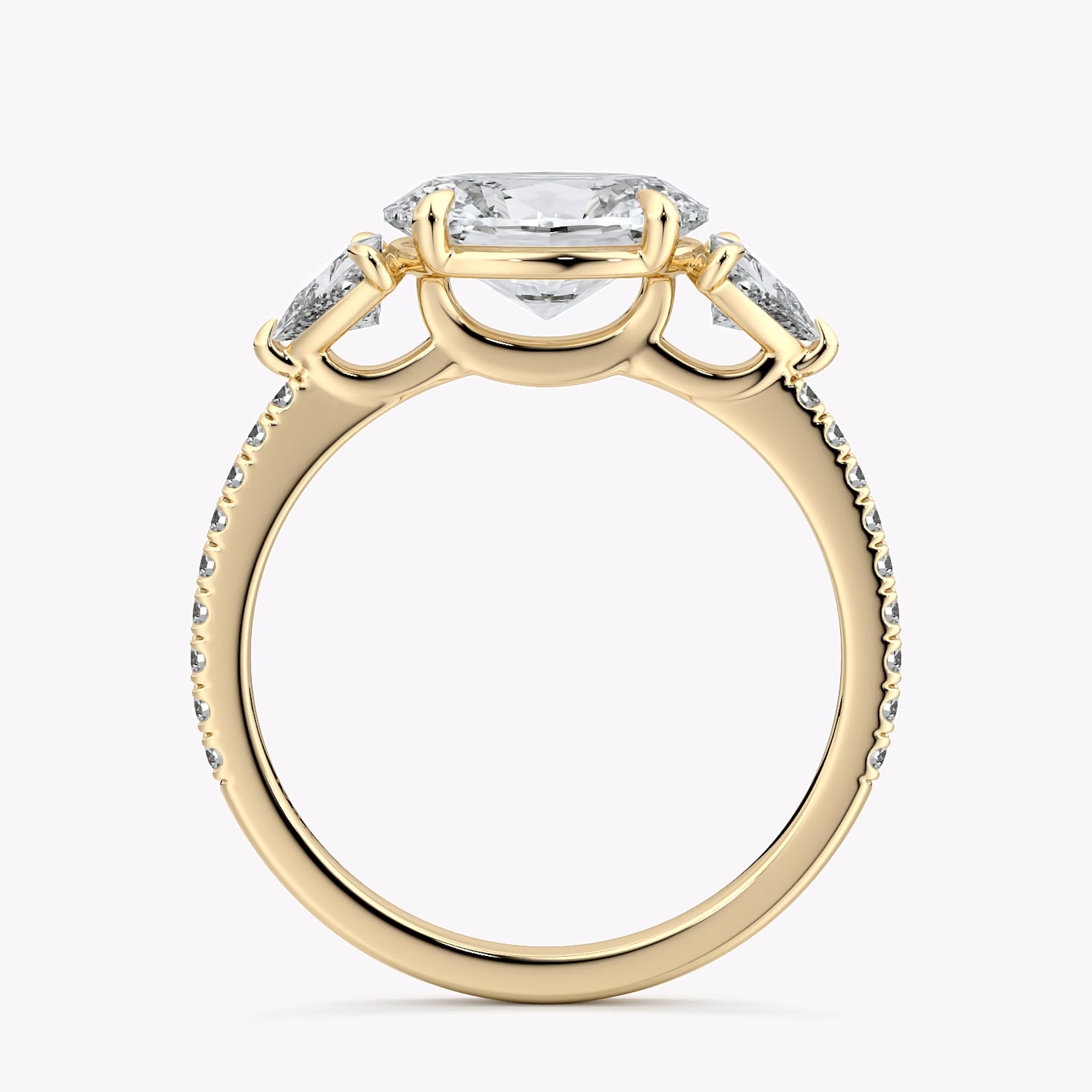 The Three Stone | Oval | 18k | Yellow Gold | bandAccent: Pavé | diamondOrientation: horizontal | sideStoneCarat: 0.25ct | sideStoneShape: Trillion | caratWeight: other