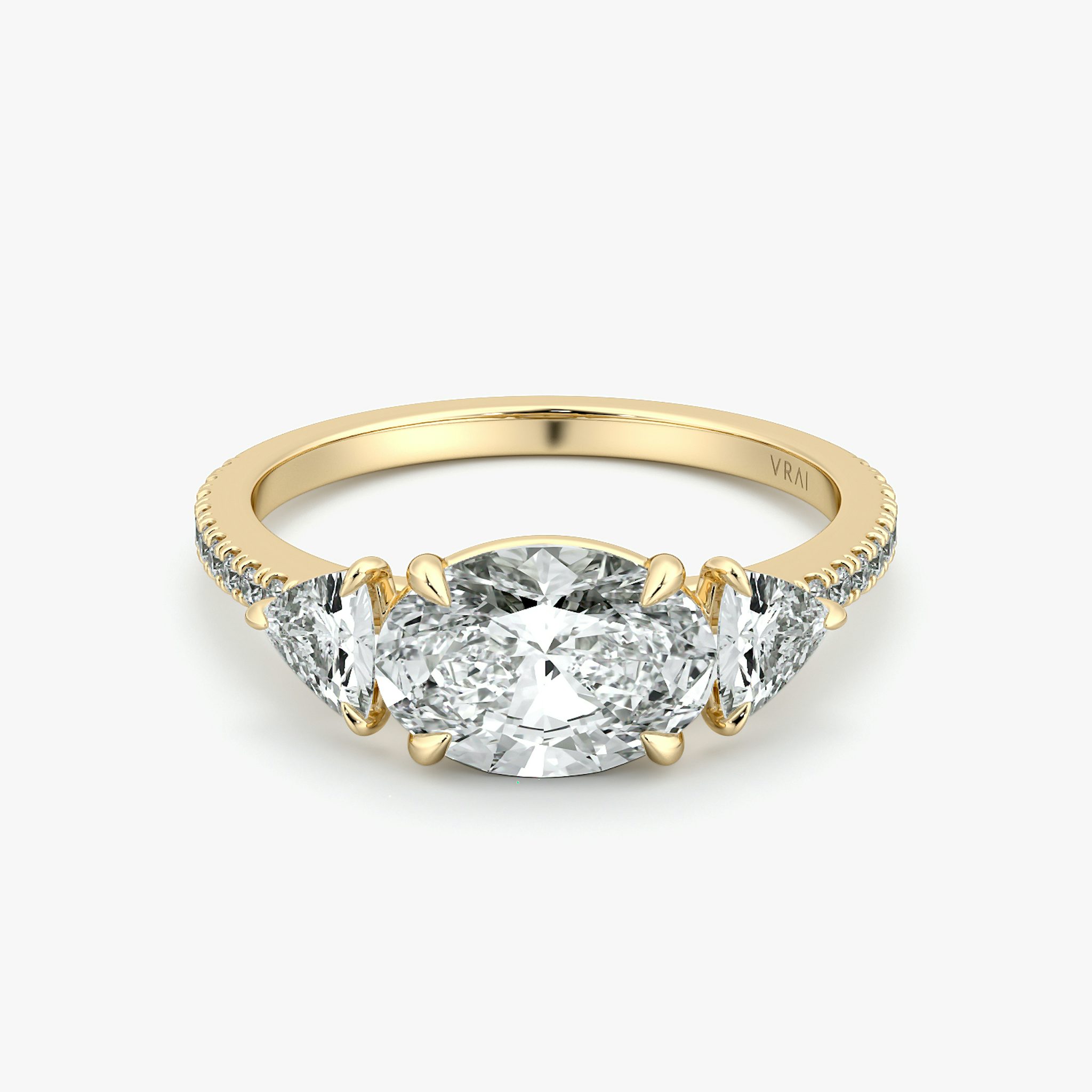 The Three Stone | Oval | 18k | Yellow Gold | bandAccent: Pavé | diamondOrientation: horizontal | sideStoneCarat: 0.25ct | sideStoneShape: Trillion | caratWeight: other
