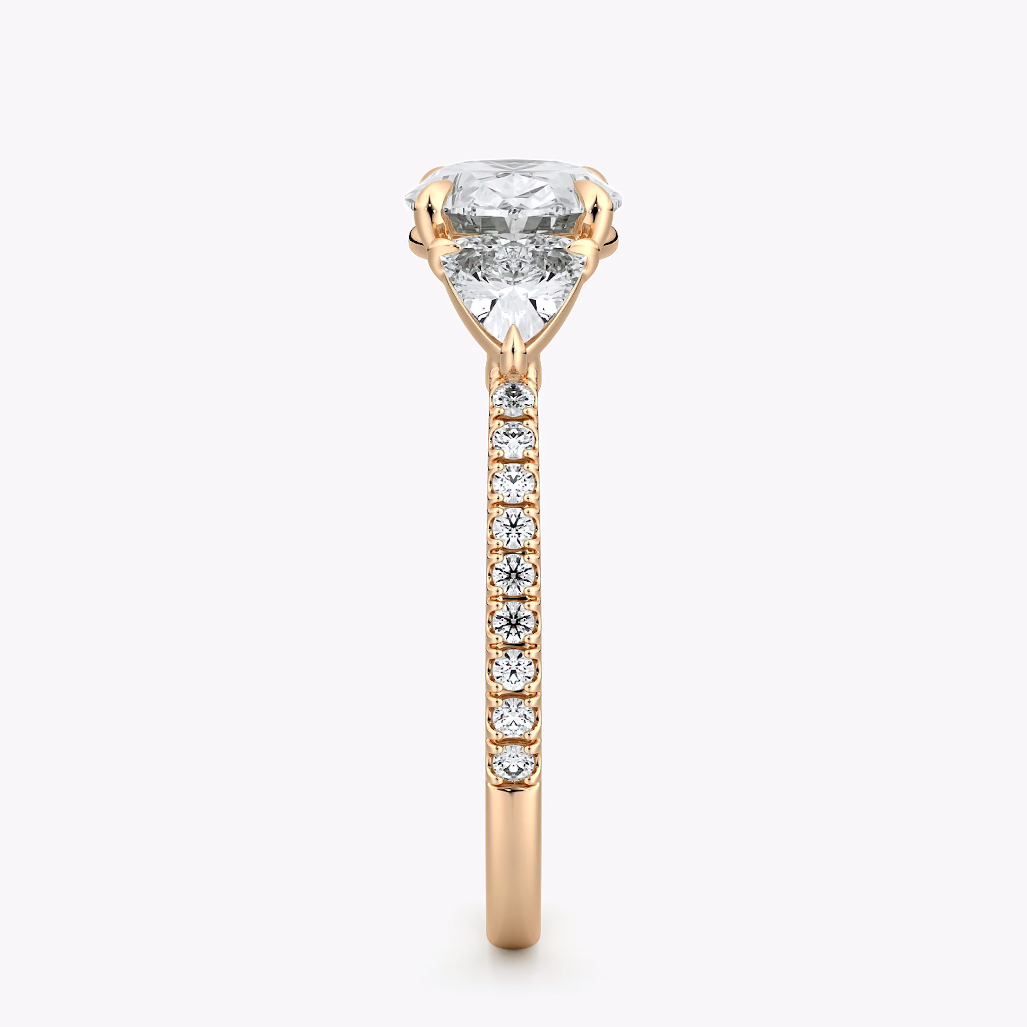 The Three Stone | Oval | 14k | Rose Gold | bandAccent: Pavé | diamondOrientation: horizontal | sideStoneCarat: 0.25ct | sideStoneShape: Trillion | caratWeight: other