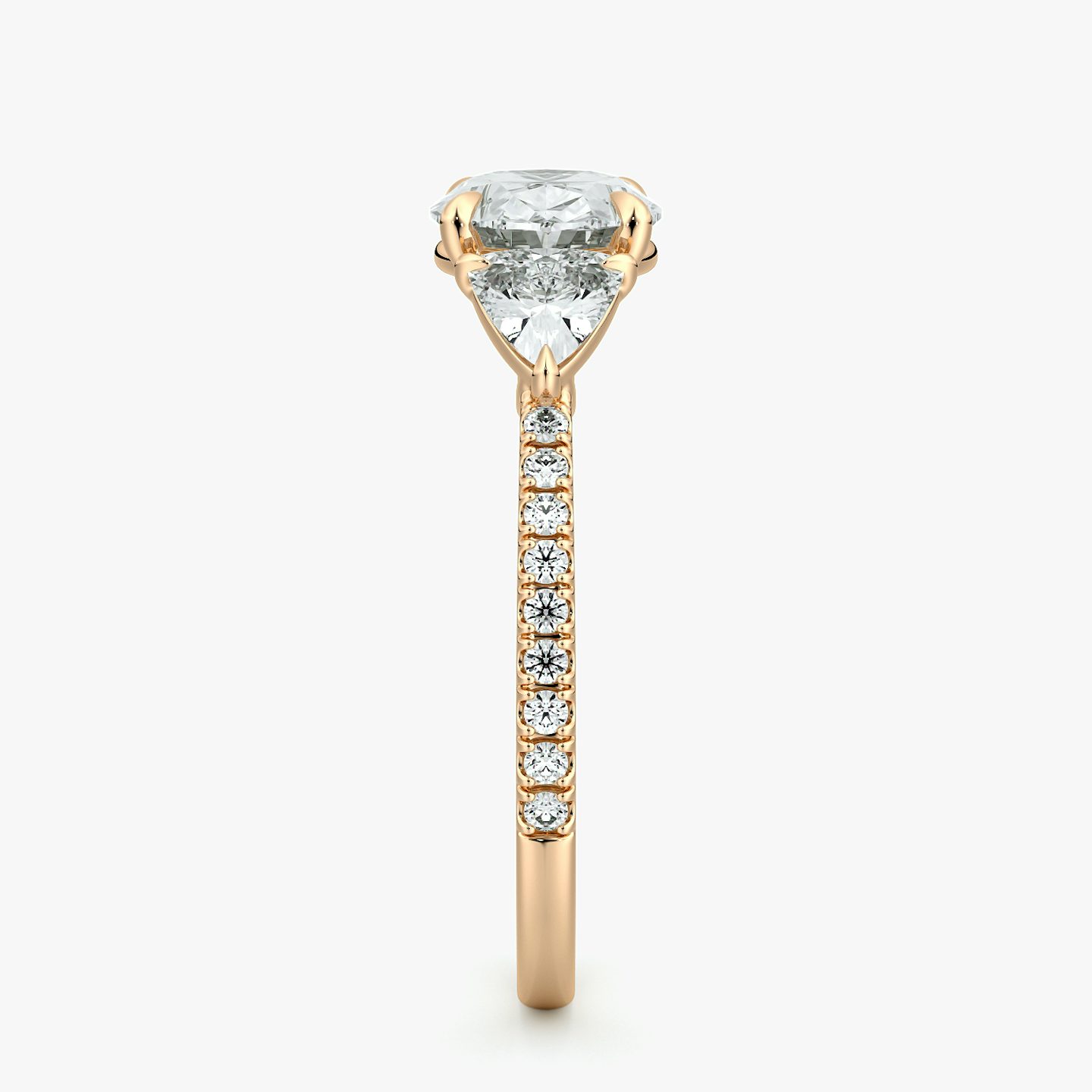 The Three Stone | Oval | 14k | Rose Gold | bandAccent: Pavé | diamondOrientation: horizontal | sideStoneCarat: 0.25ct | sideStoneShape: Trillion | caratWeight: other