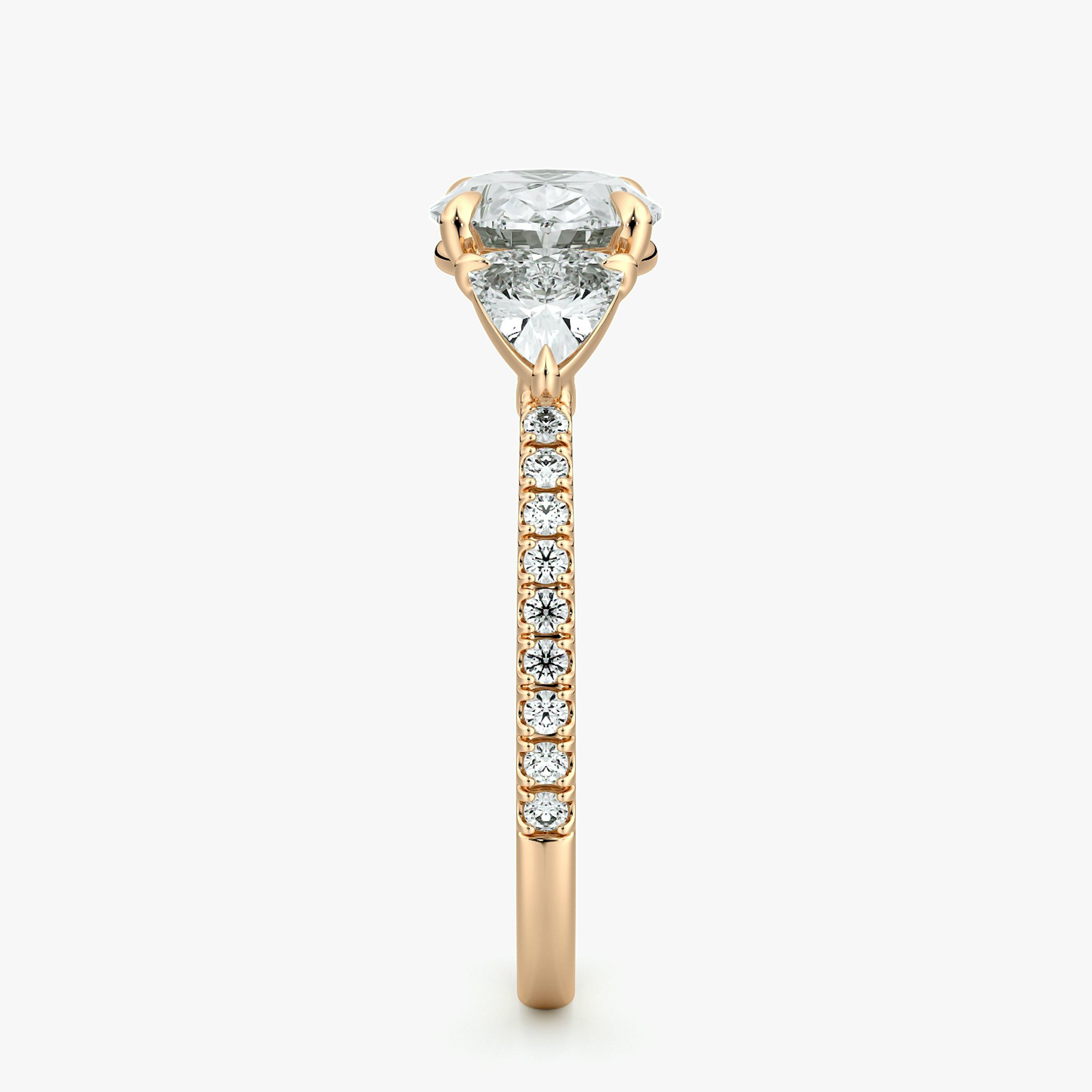 The Three Stone | Oval | 14k | Rose Gold | bandAccent: Pavé | diamondOrientation: horizontal | sideStoneCarat: 0.25ct | sideStoneShape: Trillion | caratWeight: other