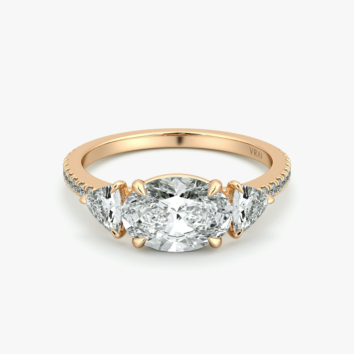 The Three Stone | Oval | 14k | Rose Gold | bandAccent: Pavé | diamondOrientation: horizontal | sideStoneCarat: 0.25ct | sideStoneShape: Trillion | caratWeight: other