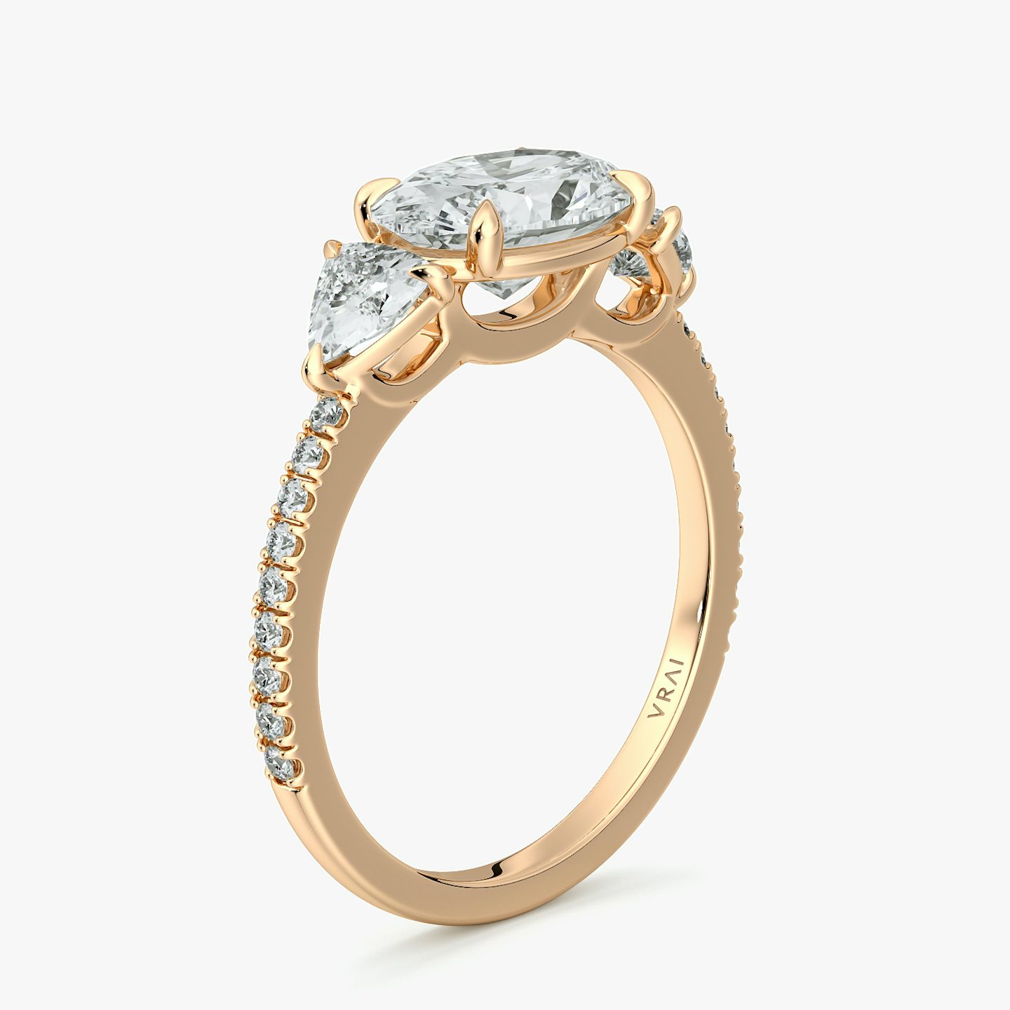 The Three Stone | Oval | 14k | Rose Gold | bandAccent: Pavé | diamondOrientation: horizontal | sideStoneCarat: 0.25ct | sideStoneShape: Trillion | caratWeight: other