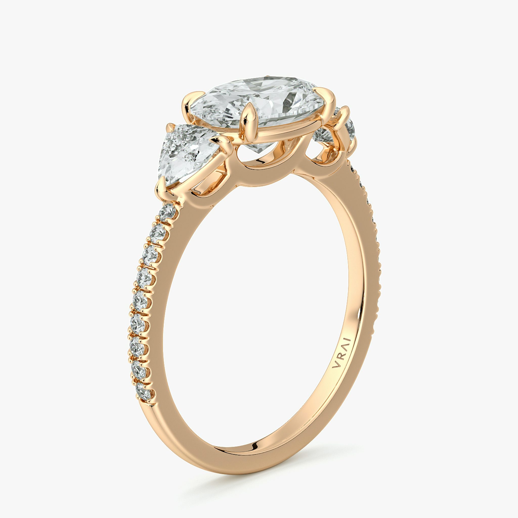 The Three Stone | Oval | 14k | Rose Gold | bandAccent: Pavé | diamondOrientation: horizontal | sideStoneCarat: 0.25ct | sideStoneShape: Trillion | caratWeight: other