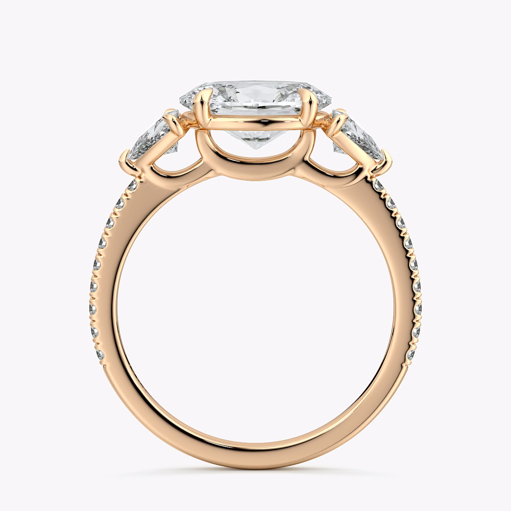 The Three Stone | Oval | 14k | Rose Gold | bandAccent: Pavé | diamondOrientation: horizontal | sideStoneCarat: 0.25ct | sideStoneShape: Trillion | caratWeight: other