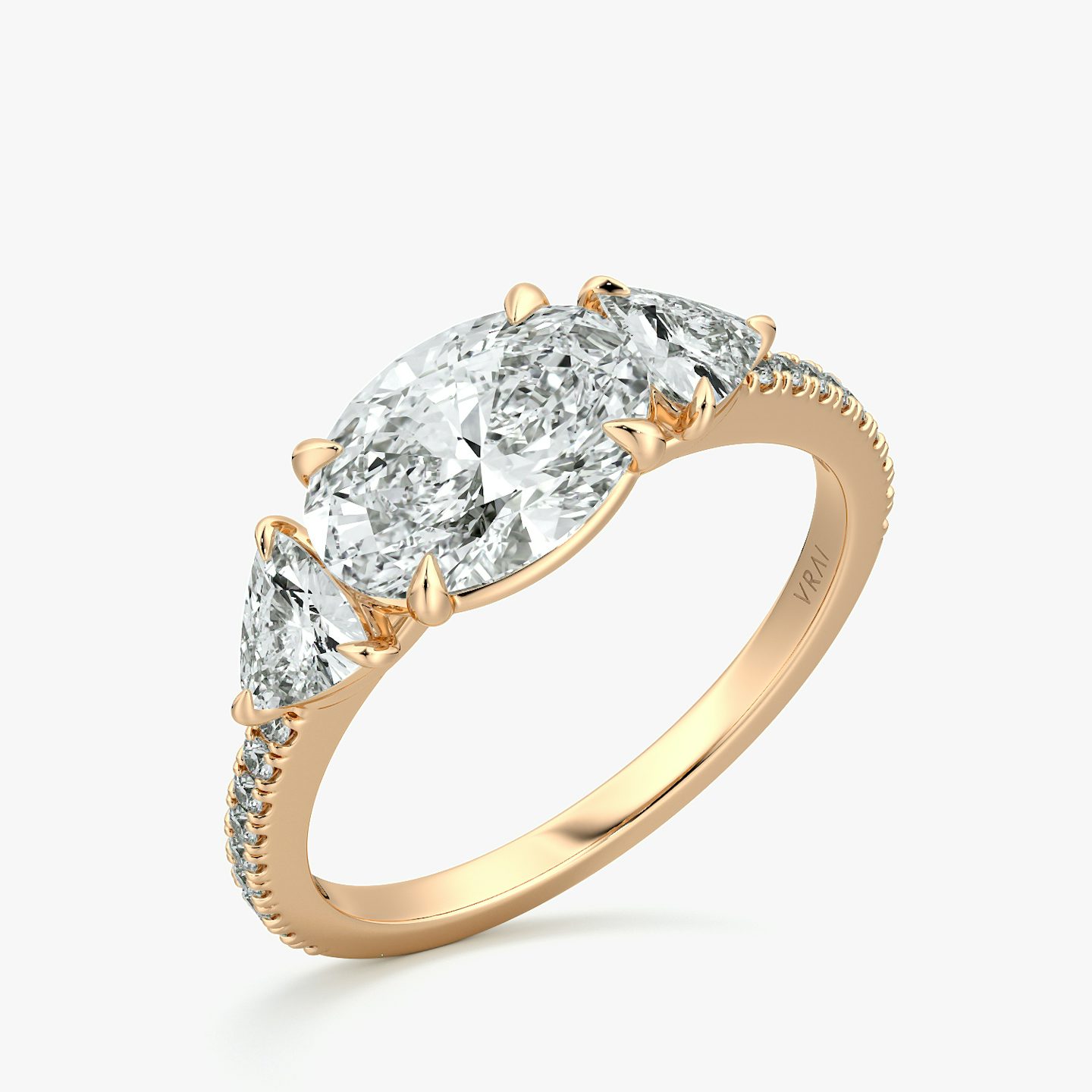 The Three Stone | Oval | 14k | Rose Gold | bandAccent: Pavé | diamondOrientation: horizontal | sideStoneCarat: 0.25ct | sideStoneShape: Trillion | caratWeight: other