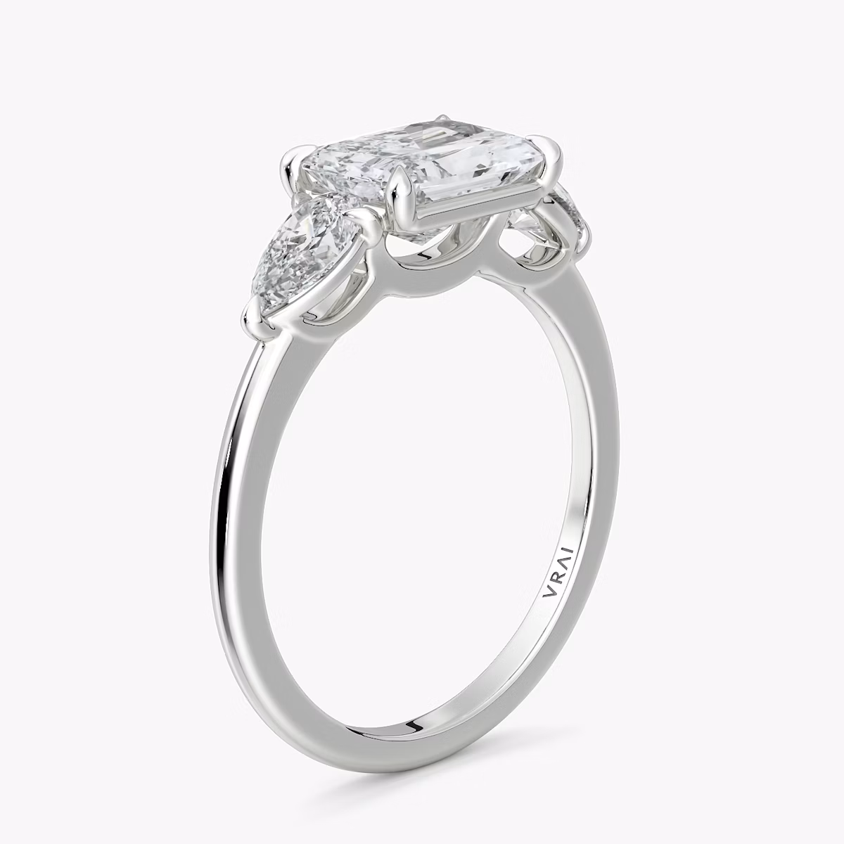 The Three Stone | Radiant | Platinum | bandAccent: Plain | diamondOrientation: horizontal | sideStoneCarat: 0.25ct | sideStoneShape: Pear | caratWeight: other