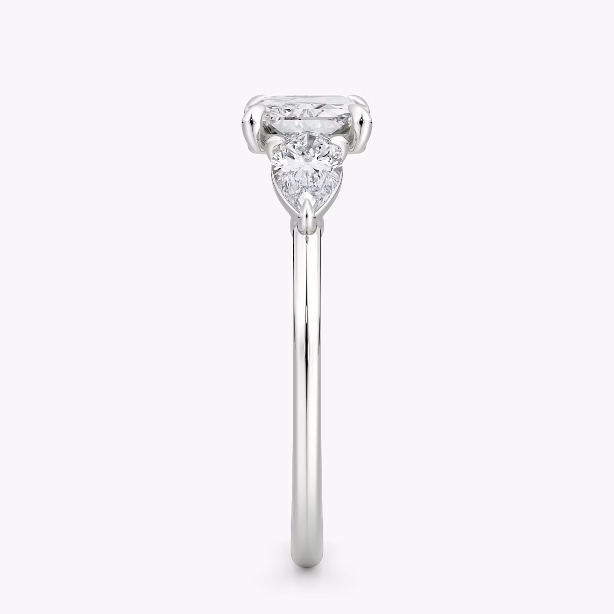 The Three Stone | Radiant | Platinum | bandAccent: Plain | diamondOrientation: horizontal | sideStoneCarat: 0.25ct | sideStoneShape: Pear | caratWeight: other