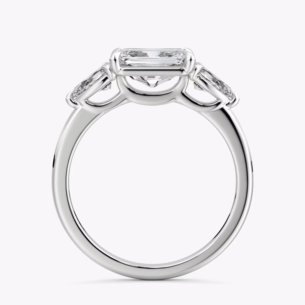The Three Stone | Radiant | Platinum | bandAccent: Plain | diamondOrientation: horizontal | sideStoneCarat: 0.25ct | sideStoneShape: Pear | caratWeight: other