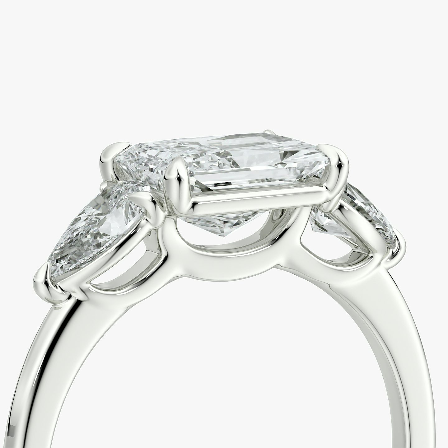 The Three Stone | Radiant | Platinum | bandAccent: Plain | diamondOrientation: horizontal | sideStoneCarat: 0.25ct | sideStoneShape: Pear | caratWeight: other