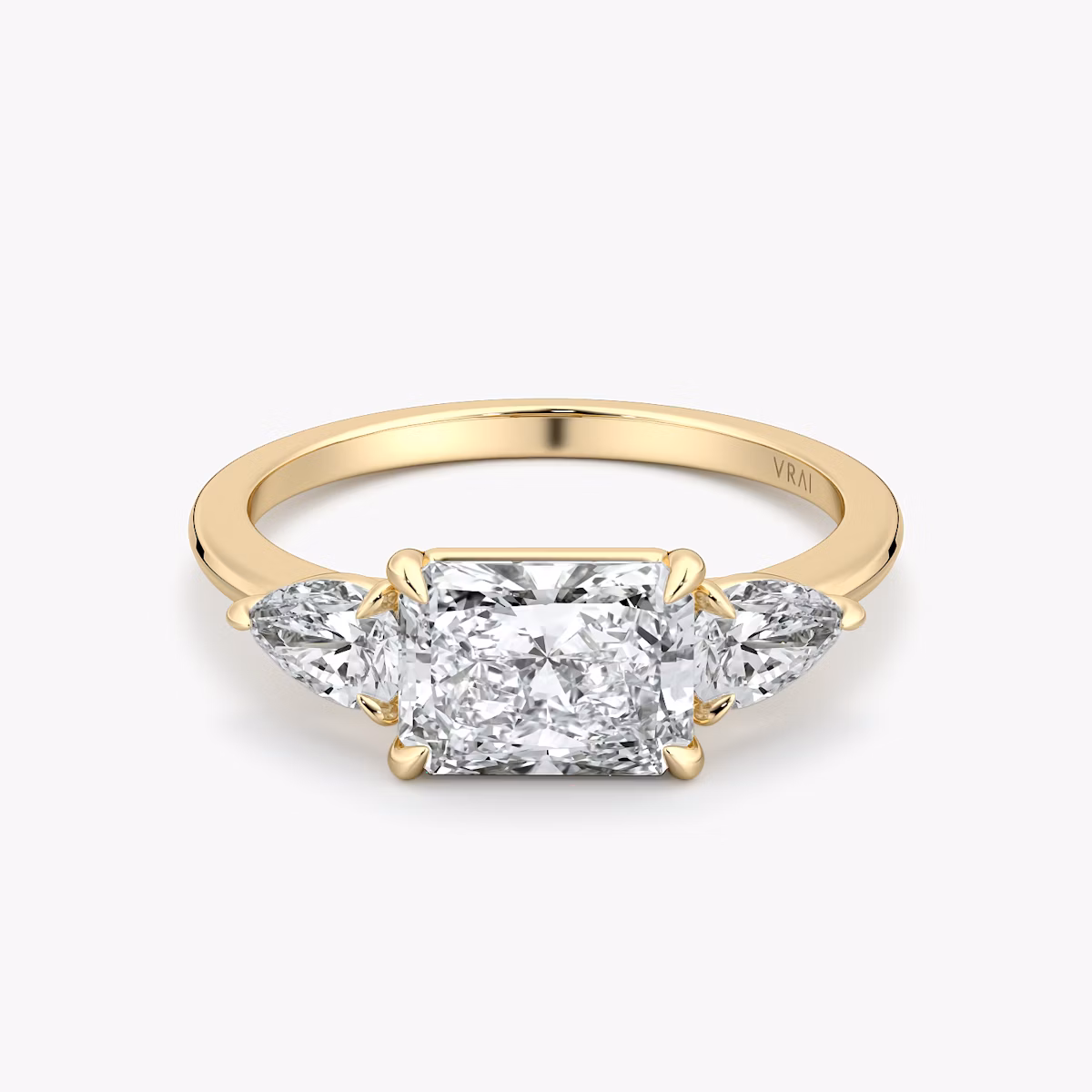 The Three Stone | Radiant | 18k | Yellow Gold | bandAccent: Plain | diamondOrientation: horizontal | sideStoneCarat: 0.25ct | sideStoneShape: Pear | caratWeight: other