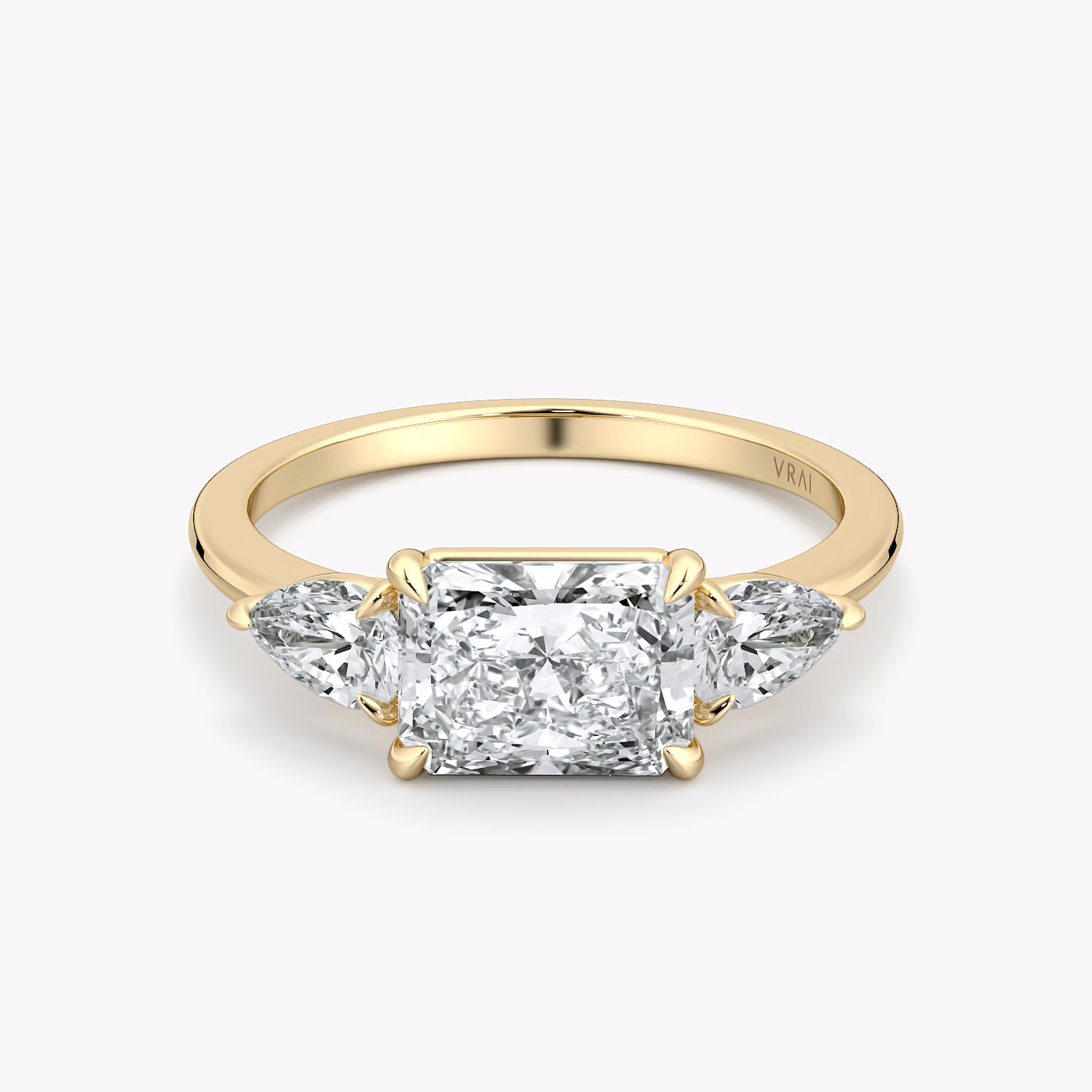 The Three Stone | Radiant | 18k | Yellow Gold | bandAccent: Plain | diamondOrientation: horizontal | sideStoneCarat: 0.25ct | sideStoneShape: Pear | caratWeight: other