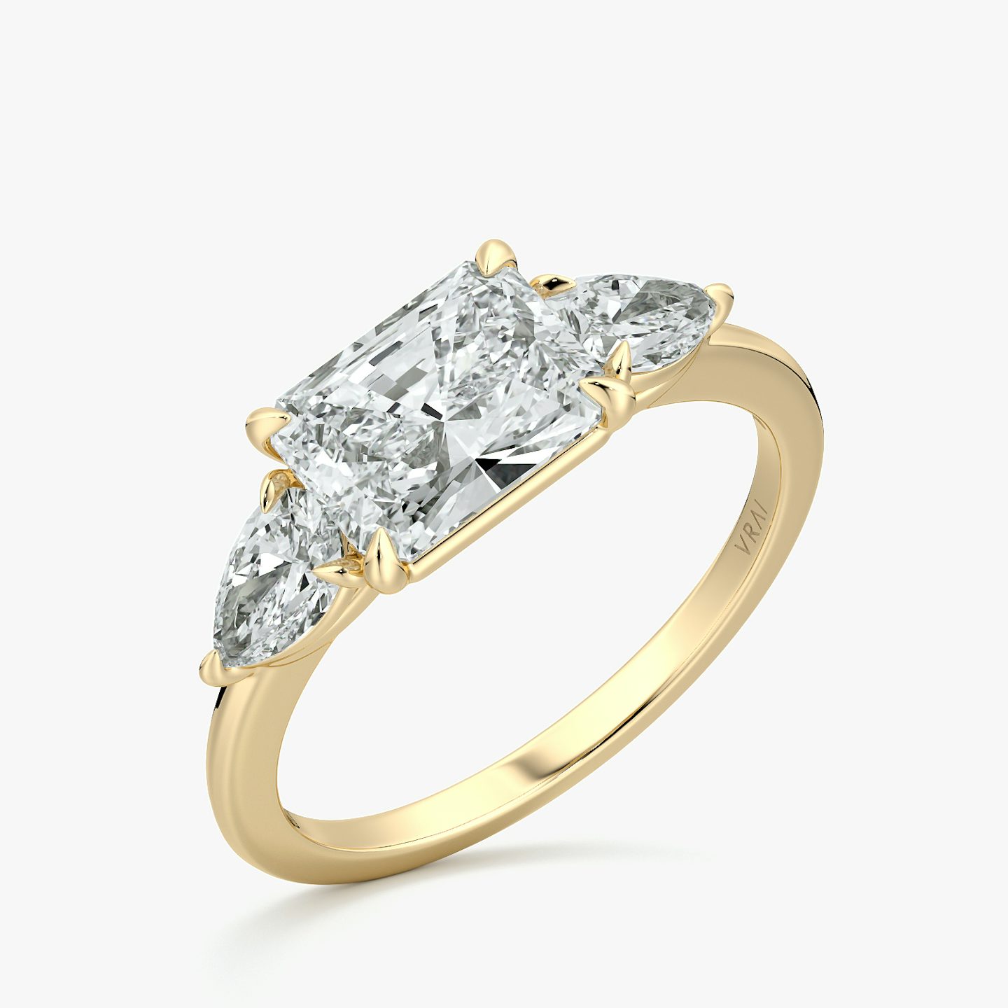 The Three Stone | Radiant | 18k | Yellow Gold | bandAccent: Plain | diamondOrientation: horizontal | sideStoneCarat: 0.25ct | sideStoneShape: Pear | caratWeight: other