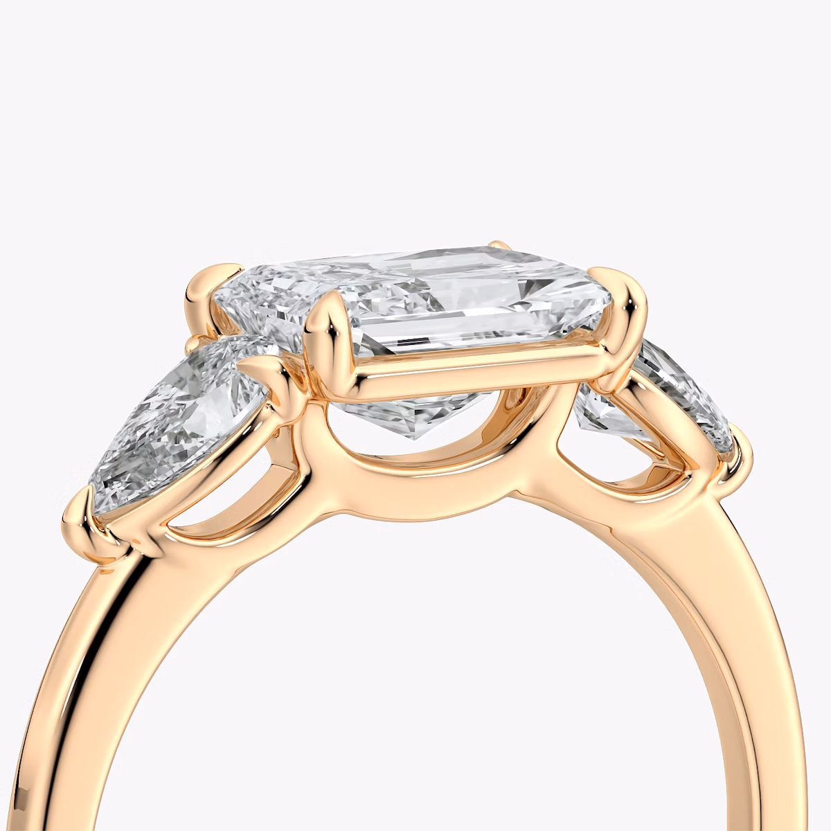 The Three Stone | Radiant | 14k | Rose Gold | bandAccent: Plain | diamondOrientation: horizontal | sideStoneCarat: 0.25ct | sideStoneShape: Pear | caratWeight: other