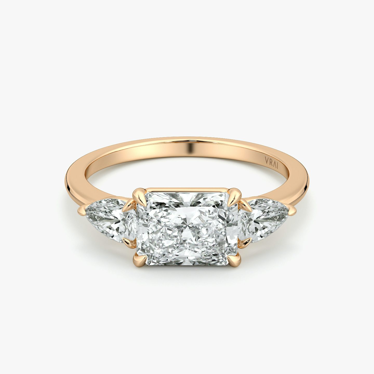 The Three Stone | Radiant | 14k | Rose Gold | bandAccent: Plain | diamondOrientation: horizontal | sideStoneCarat: 0.25ct | sideStoneShape: Pear | caratWeight: other