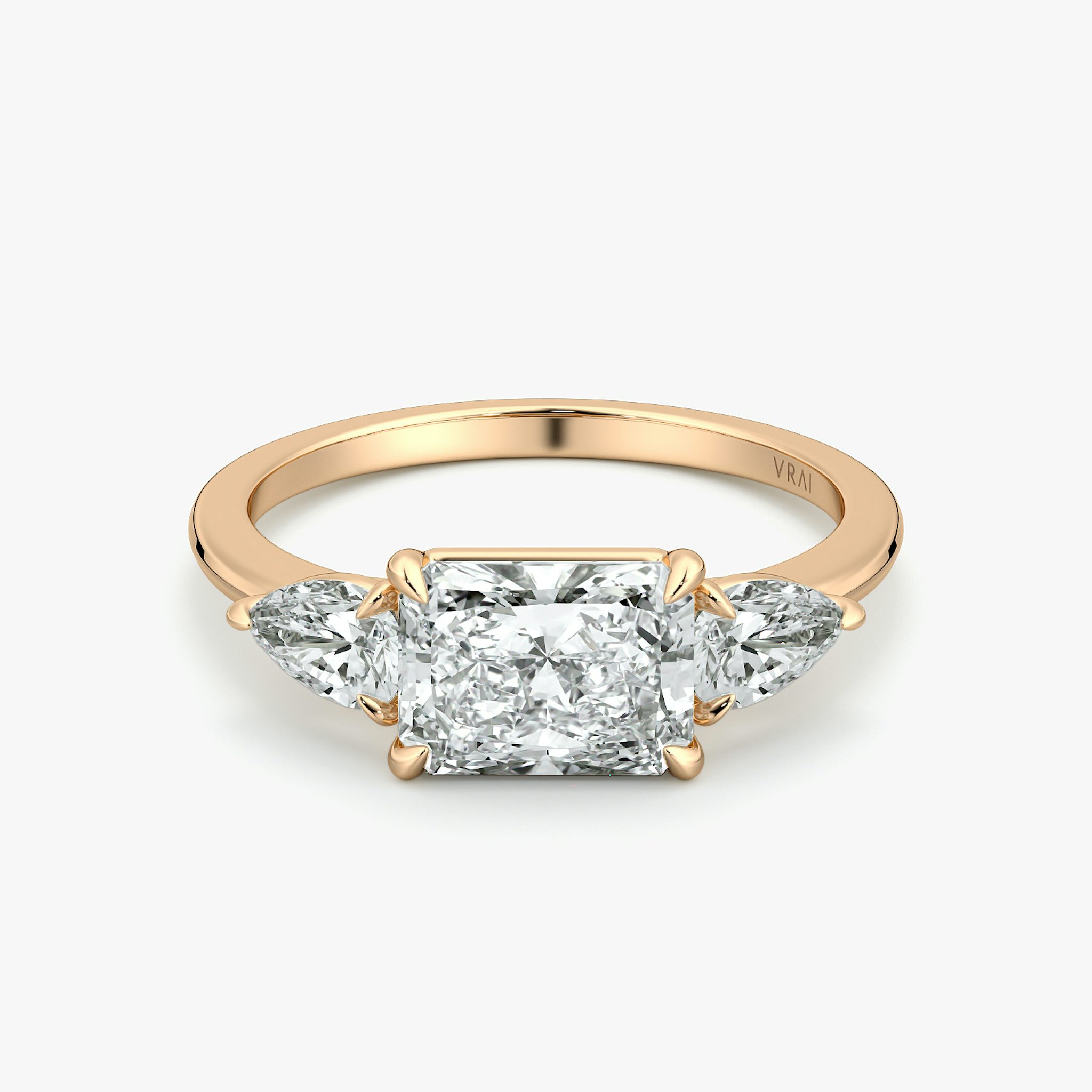The Three Stone | Radiant | 14k | Rose Gold | bandAccent: Plain | diamondOrientation: horizontal | sideStoneCarat: 0.25ct | sideStoneShape: Pear | caratWeight: other