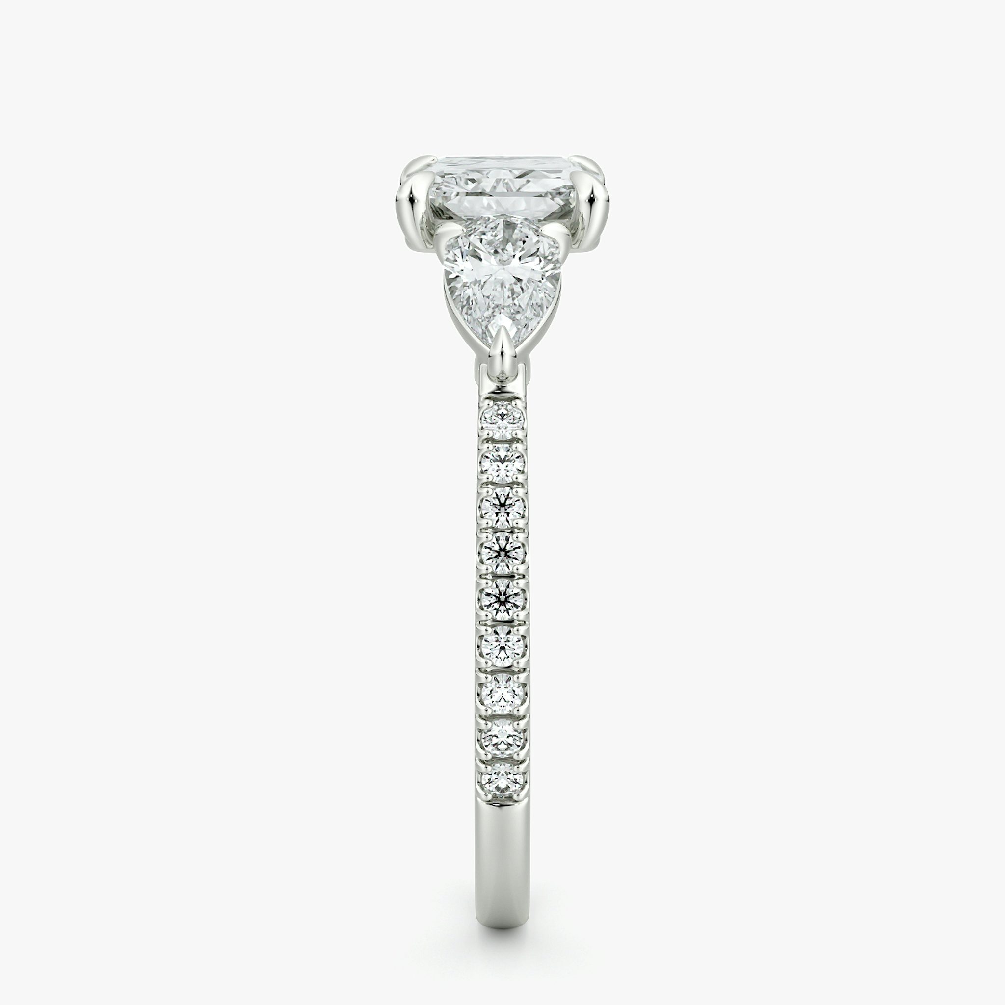 The Three Stone | Radiant | 18k | White Gold | bandAccent: Pavé | diamondOrientation: horizontal | sideStoneCarat: 0.25ct | sideStoneShape: Pear | caratWeight: other